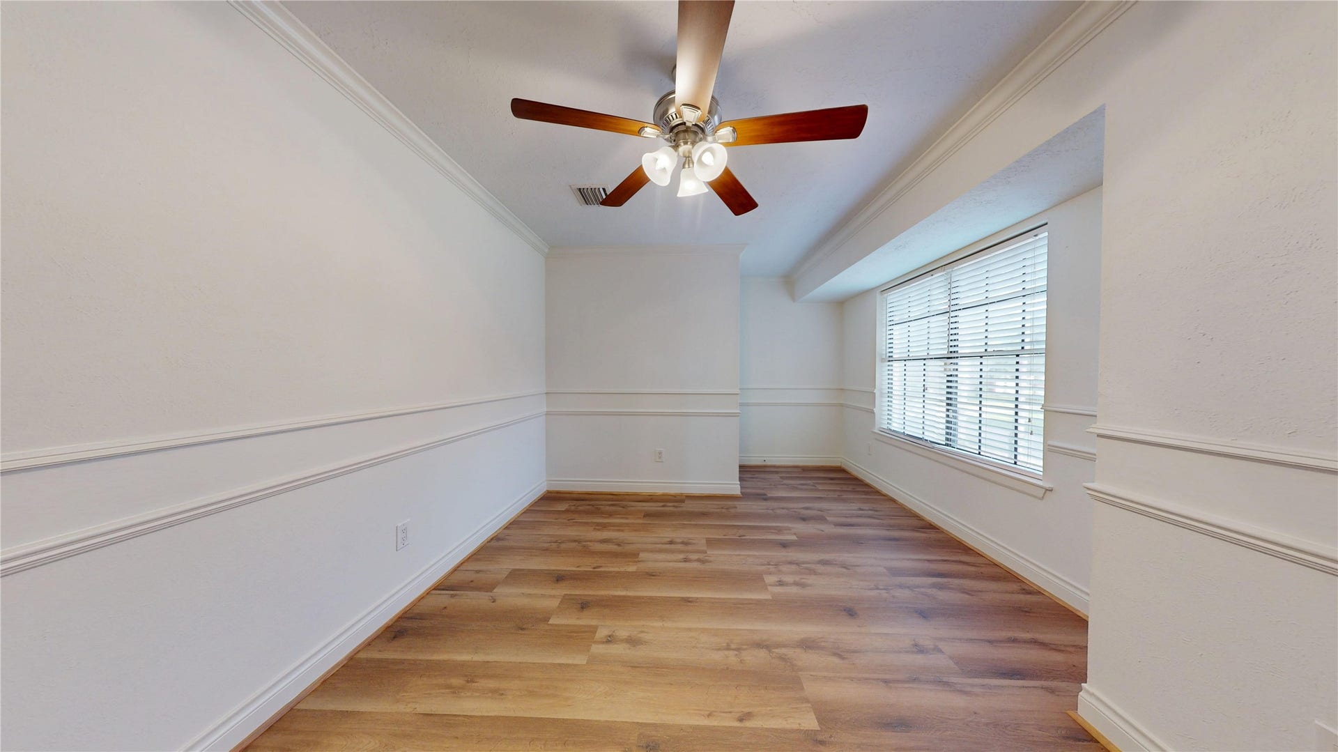 Generously sized bedroom offering flexibility for guests, family, or a home office.