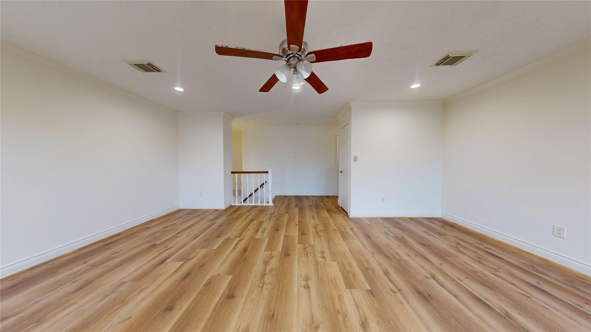 Oversized game room offers plenty of space for entertaining, games, or a versatile second living area.