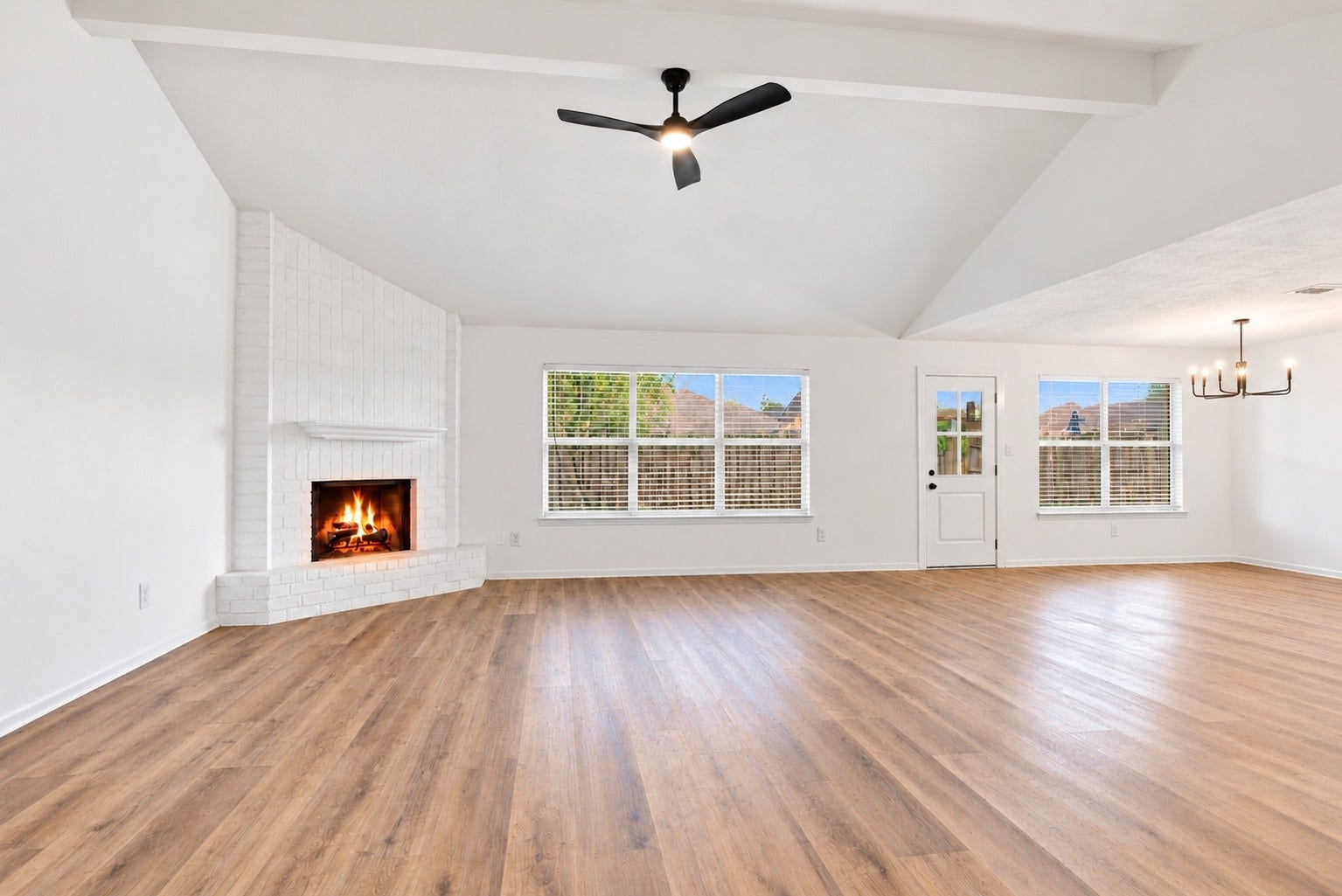 Another angle of the living room showcasing the fireplace