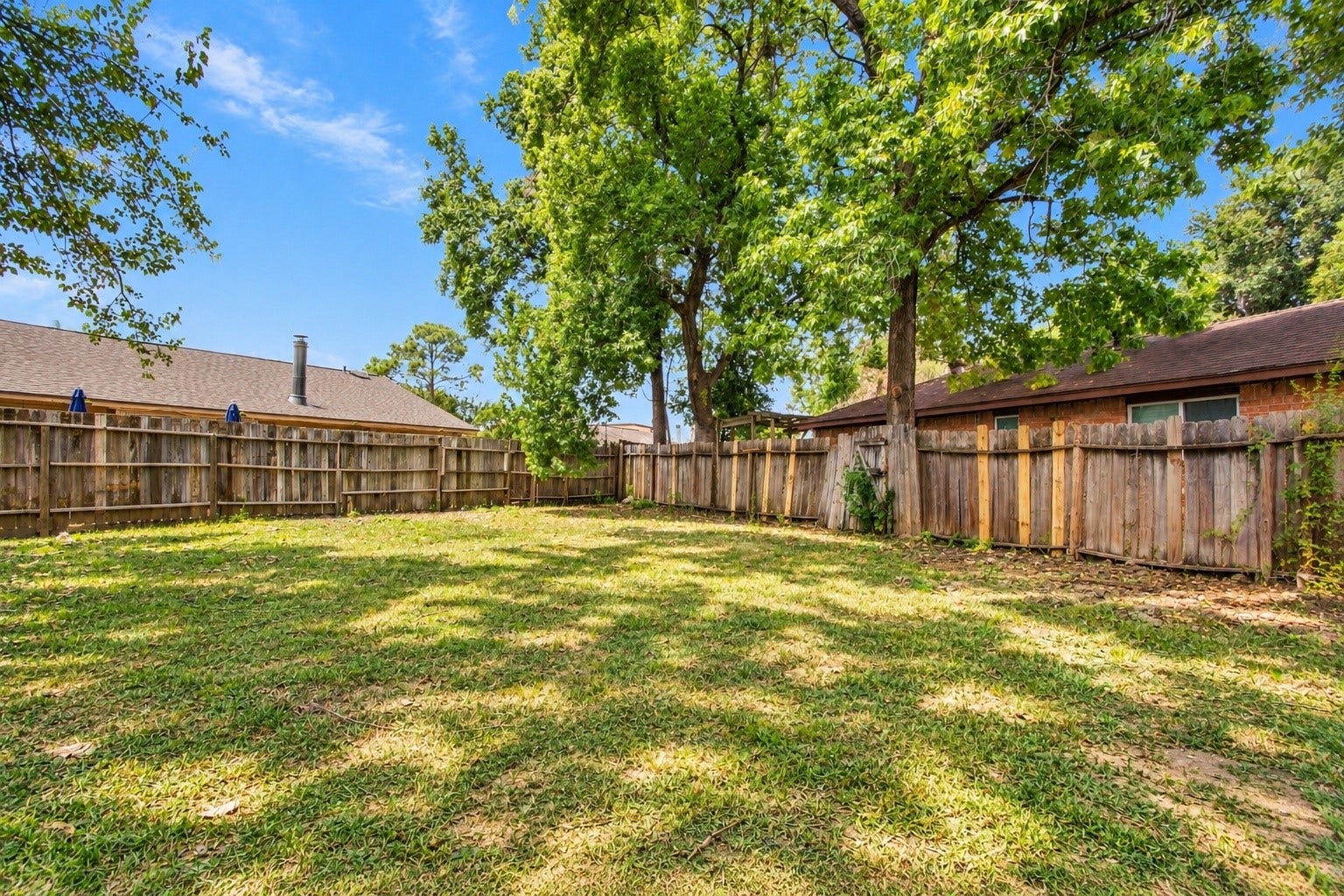 An angle of the backyard!
*This photo has AI-edited grass*