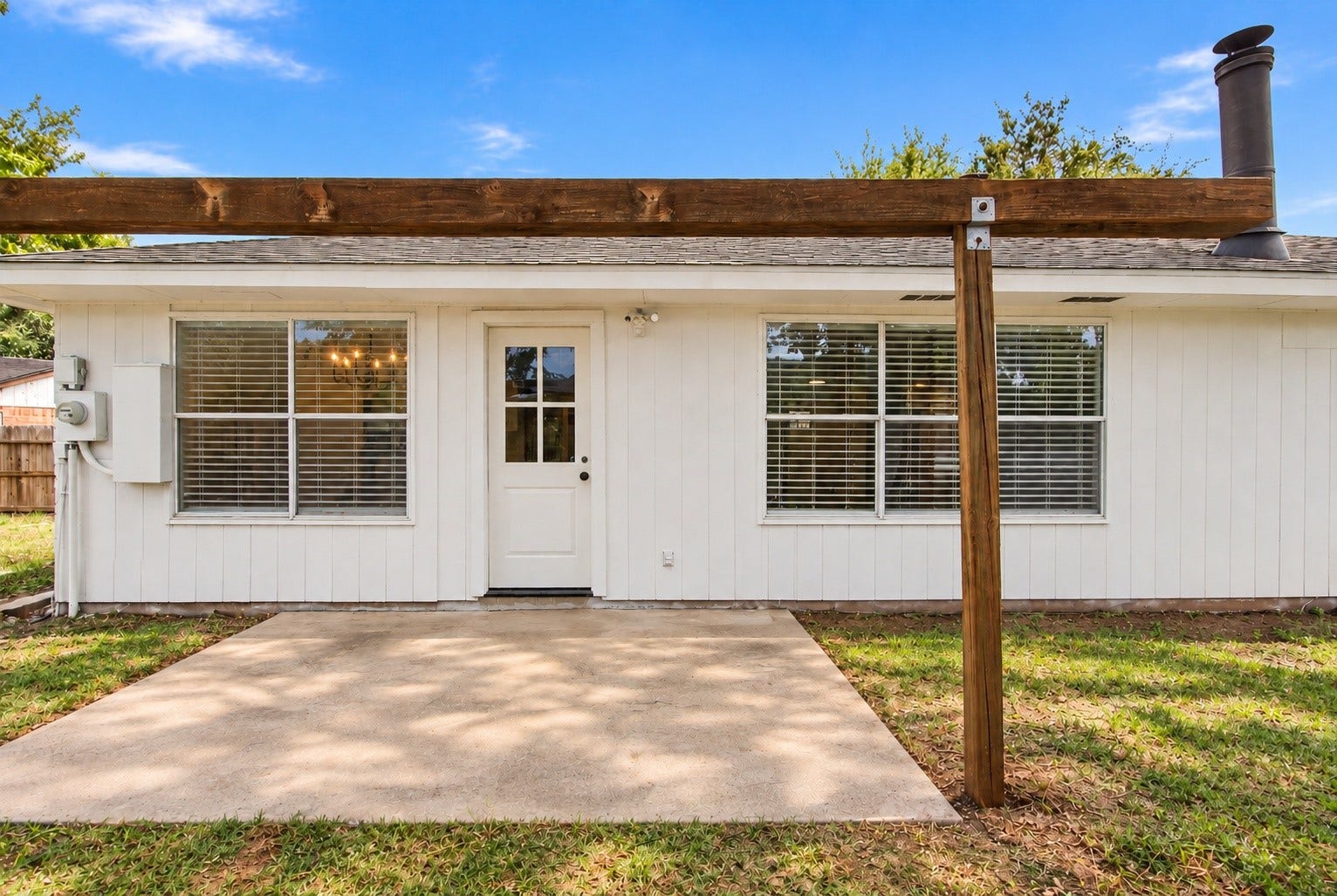 The back porch - perfect for entertaining!
*This photo has AI-edited grass*