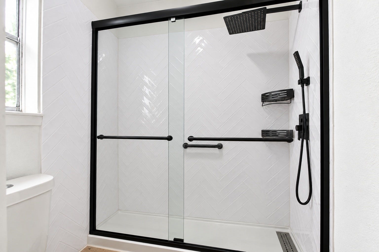 The shower has been retiled with a brand new shower glass!