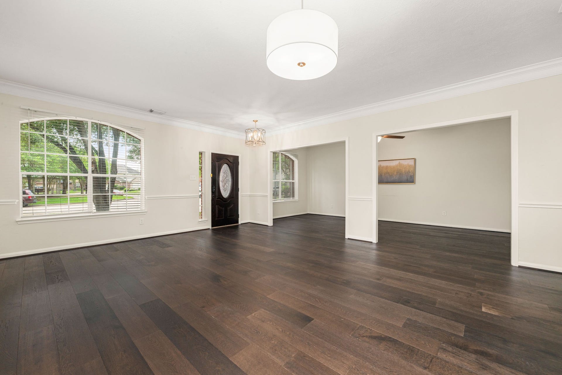 5507 River Gable Court, Sugar Land, TX 77479 Welcoming entry opens to a bright layout with formal dining on the right and flexible space on the left.