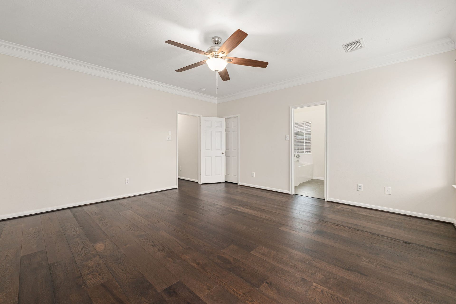 5507 River Gable Court, Sugar Land, TX 77479 Primary suite tucked away for privacy with a relaxing and spacious layout.