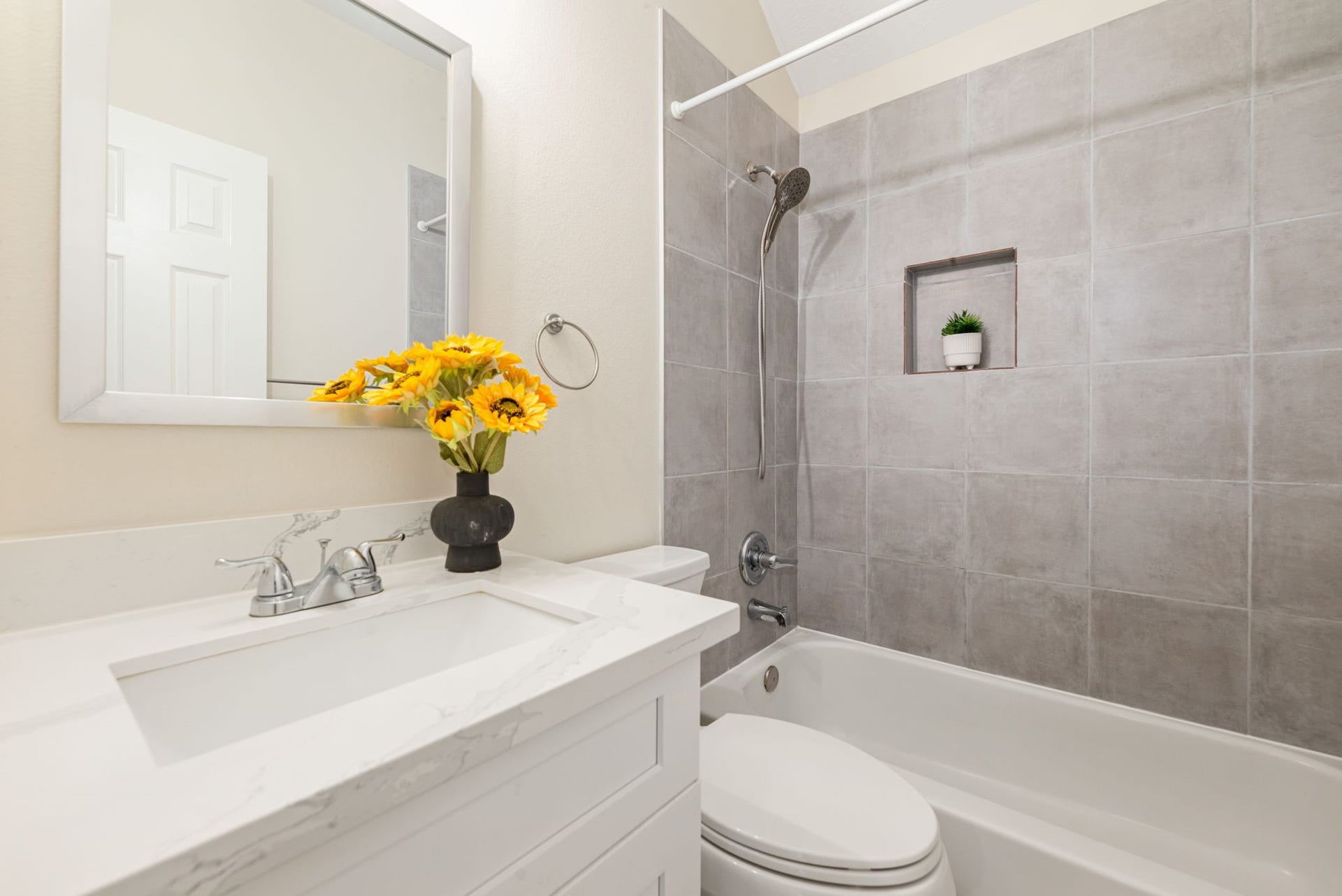 5507 River Gable Court, Sugar Land, TX 77479 Upgraded bathrooms with modern vanities, quartz counters, and updated fixtures.