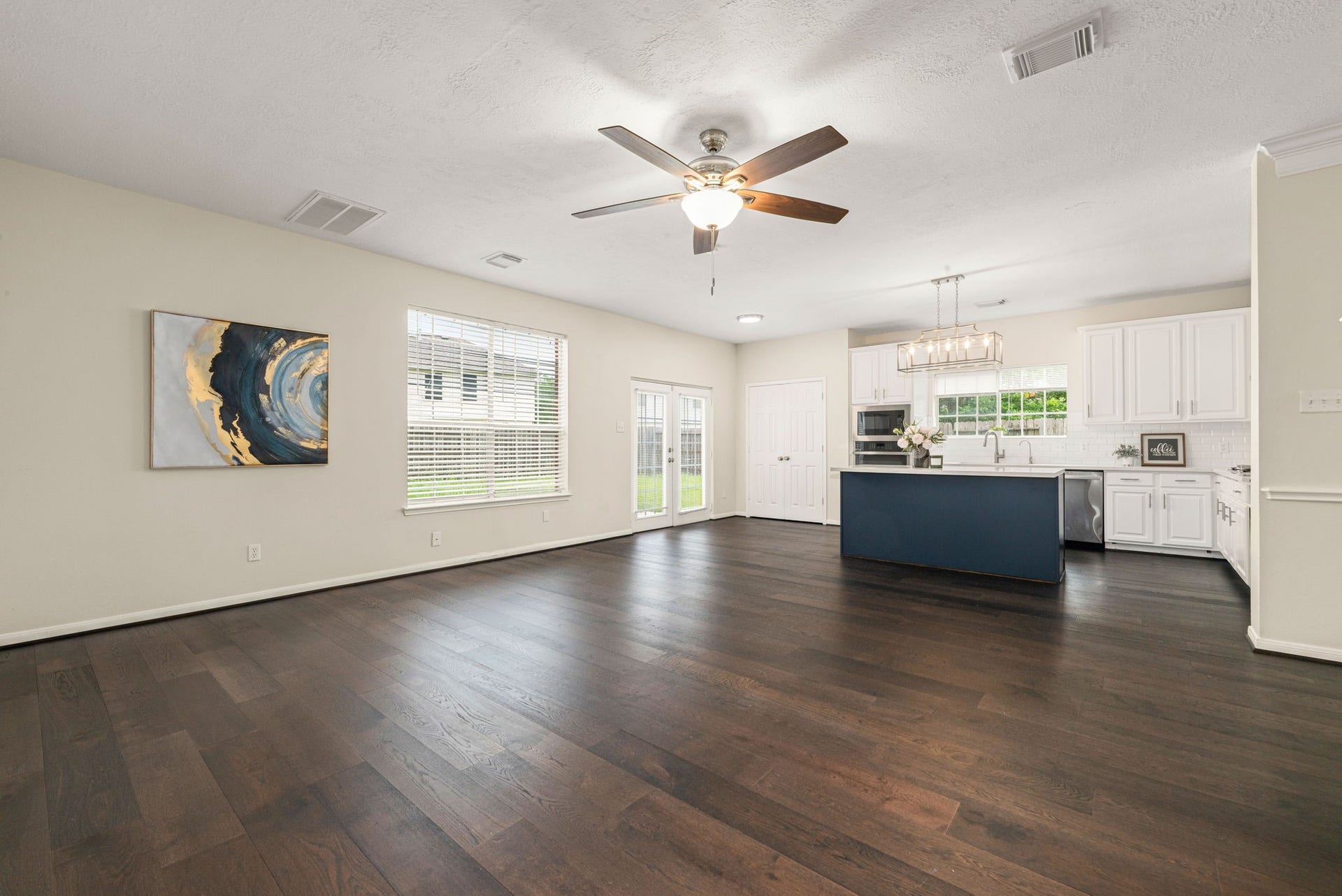5507 River Gable Court, Sugar Land, TX 77479 Spacious living room filled with natural light and a cozy gas fireplace as the focal point.