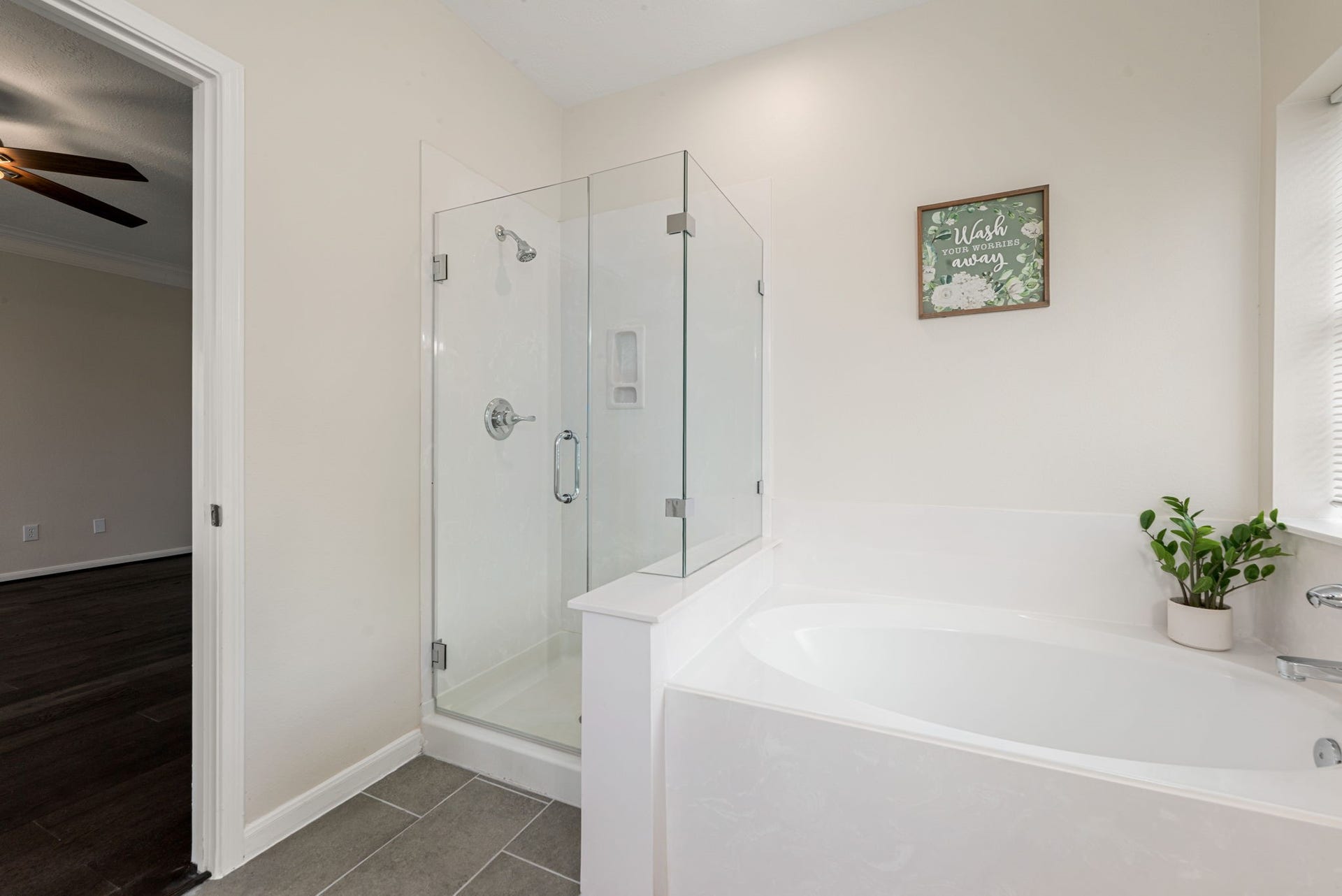 5507 River Gable Court, Sugar Land, TX 77479 Primary bathroom with double sinks, garden tub, and separate shower.