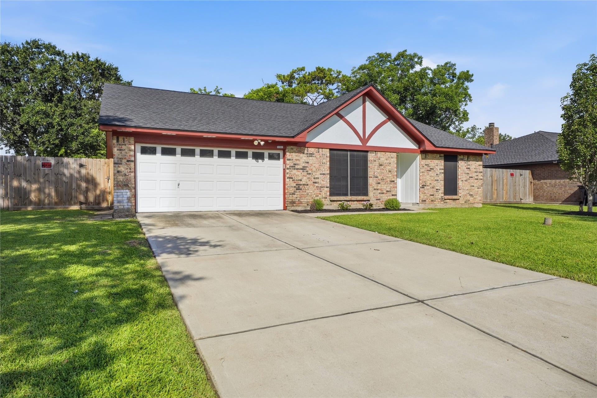 4850 Kentington Drive, Alvin, TX 77511 Extended driveway, attached two-car garage, and a spacious front yard provide both convenience and excellent curb appeal.