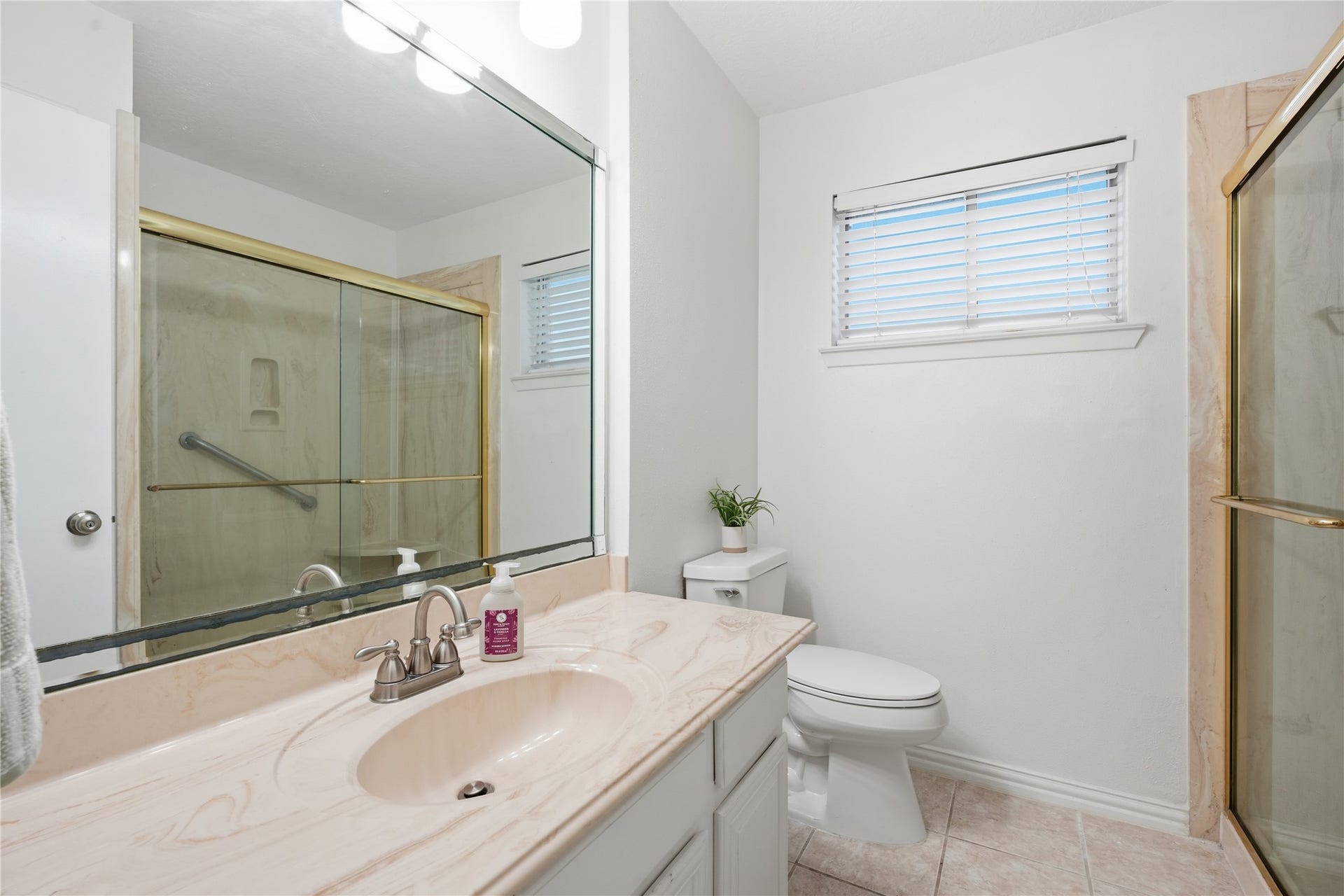 4850 Kentington Drive, Alvin, TX 77511 Secondary bathroom featuring an oversized vanity with ample counter space, a large mirror, and a walk-in shower.
