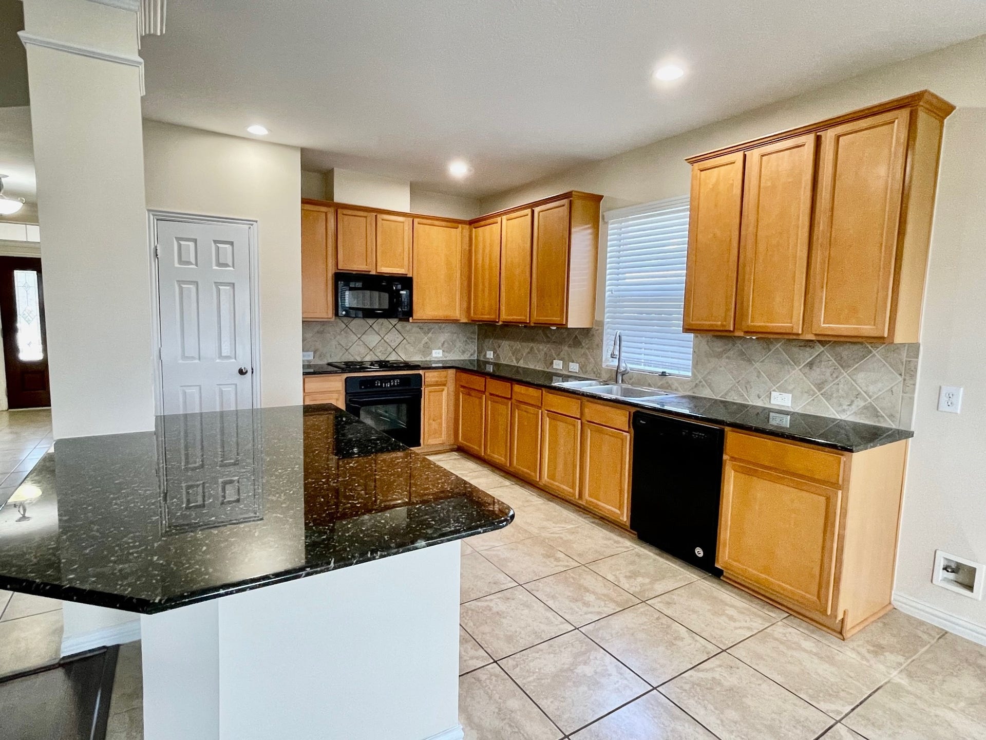 823 Aqua Vista, Richmond, TX 77469 Spacious Granted island kitchen overlook the family room