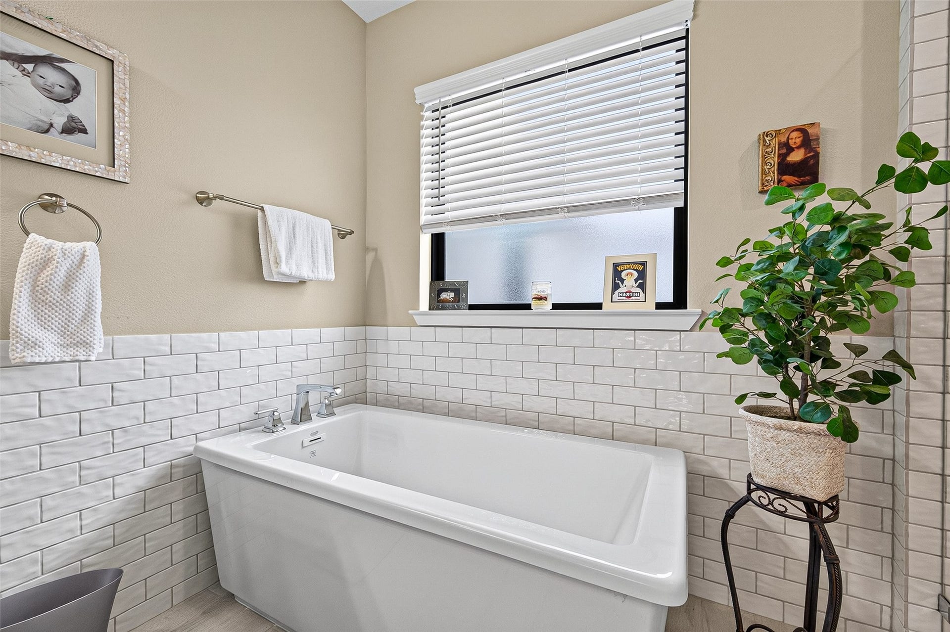 3508 Harvest Dance Drive, Houston, TX 77008 Large soaking tub under the frosted glass window allows space for a small table or chair if you like.