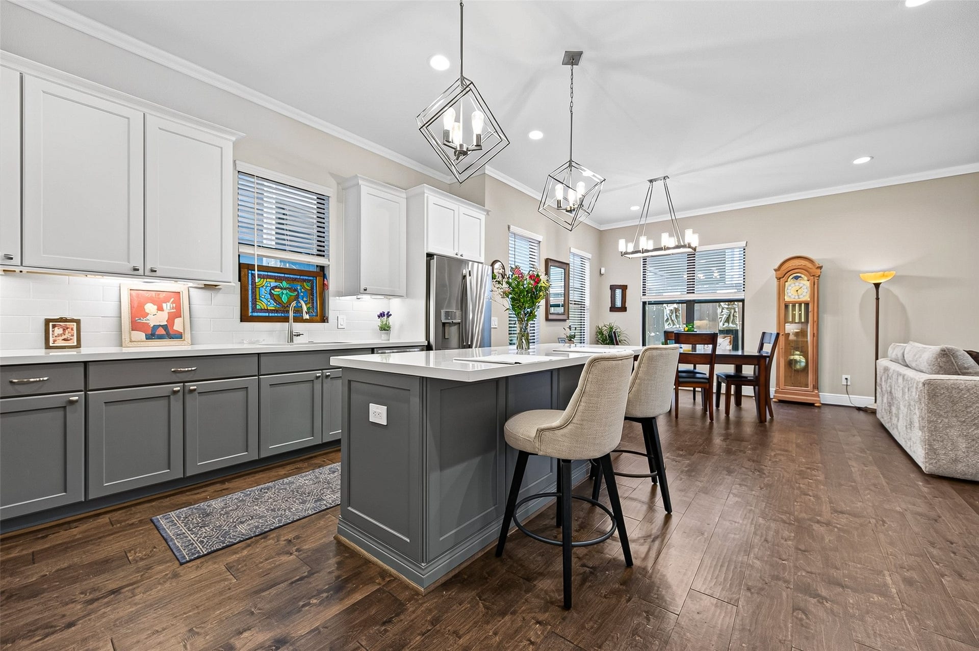 3508 Harvest Dance Drive, Houston, TX 77008 The pendant lighting adds another level of design with it's geometric shape. Note the longer windows that allow natural light into the main level "great space".