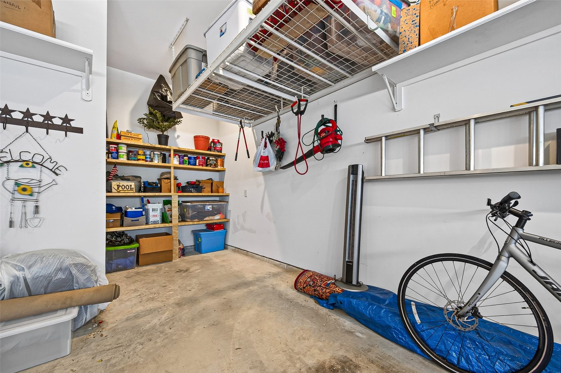 3508 Harvest Dance Drive, Houston, TX 77008 Oversized double garage with high ceilings tout the custom storage features the owner added. A great designer look to bring finesse to this space.