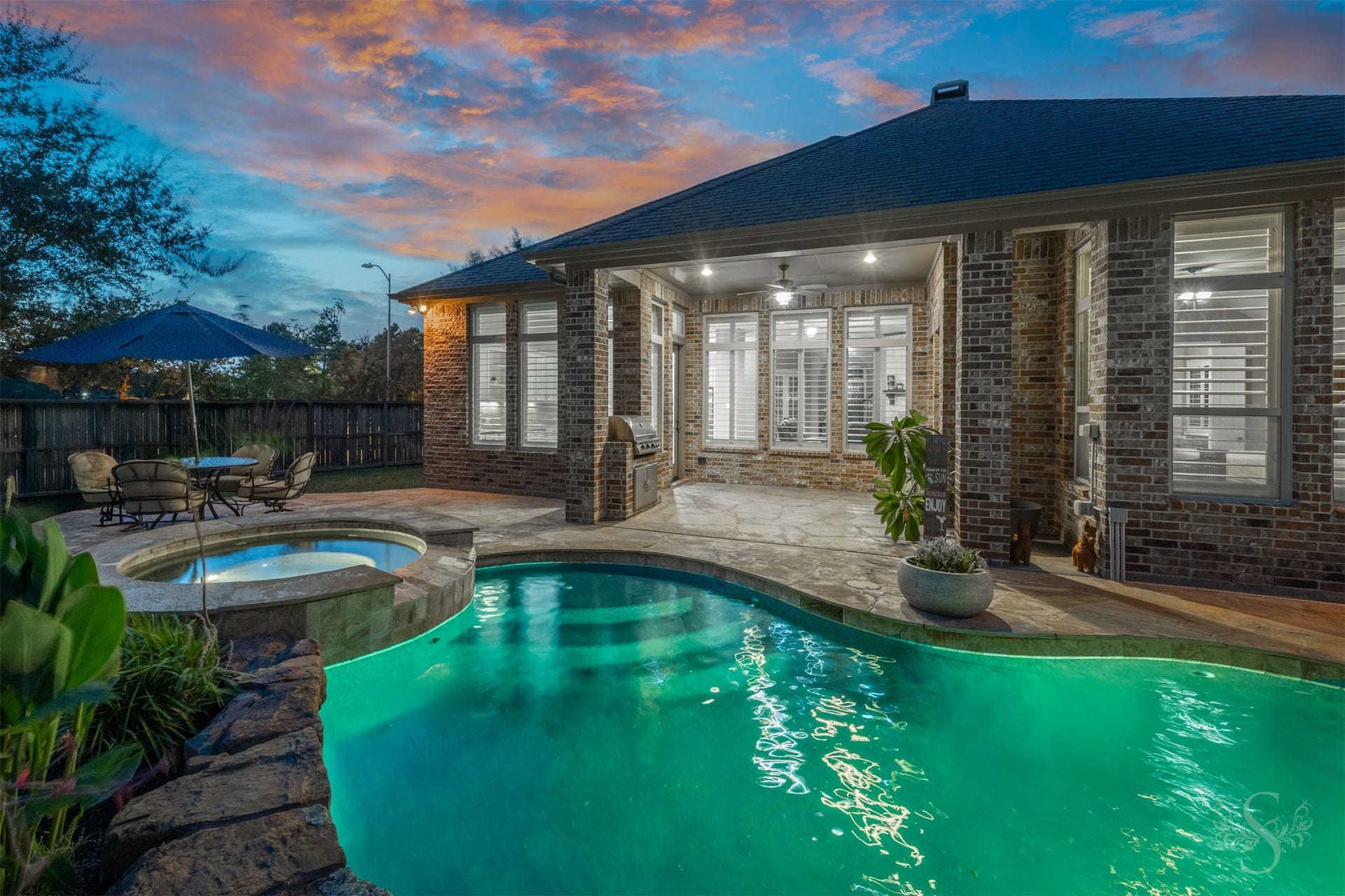As the sun sets, this spectacular backyard PARADISE comes alive with a glowing pool and spa, dramatic rock waterfalls and beautiful accent lighting. Expansive patio space, a spacious covered patio and an outdoor kitchen create an extraordinary resort-style setting for unforgettable evenings at home.