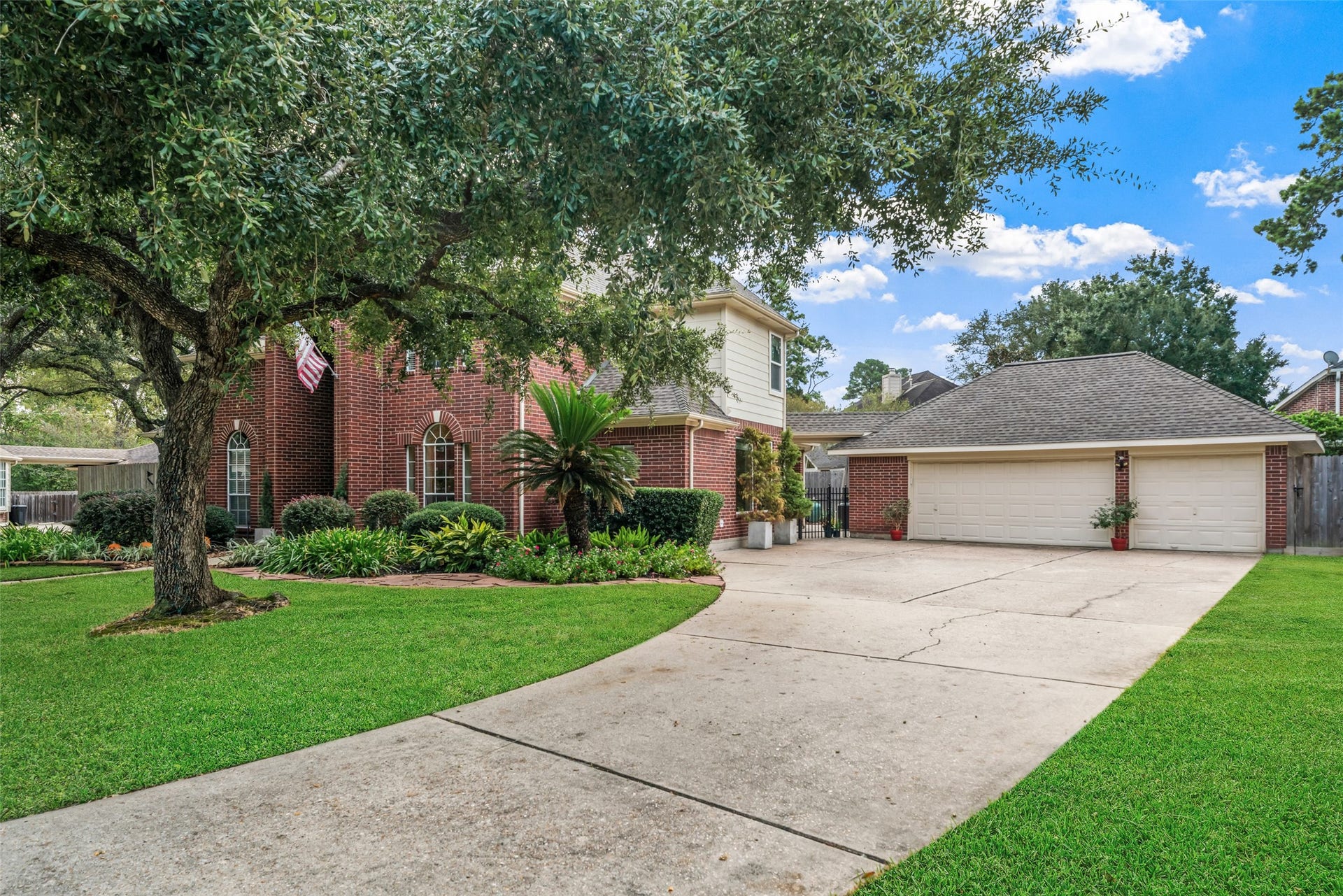 3507 Aspen Glen Lane, Spring, TX 77388 A 3-car garage and, again, more storage with a ladder to access the upper level.