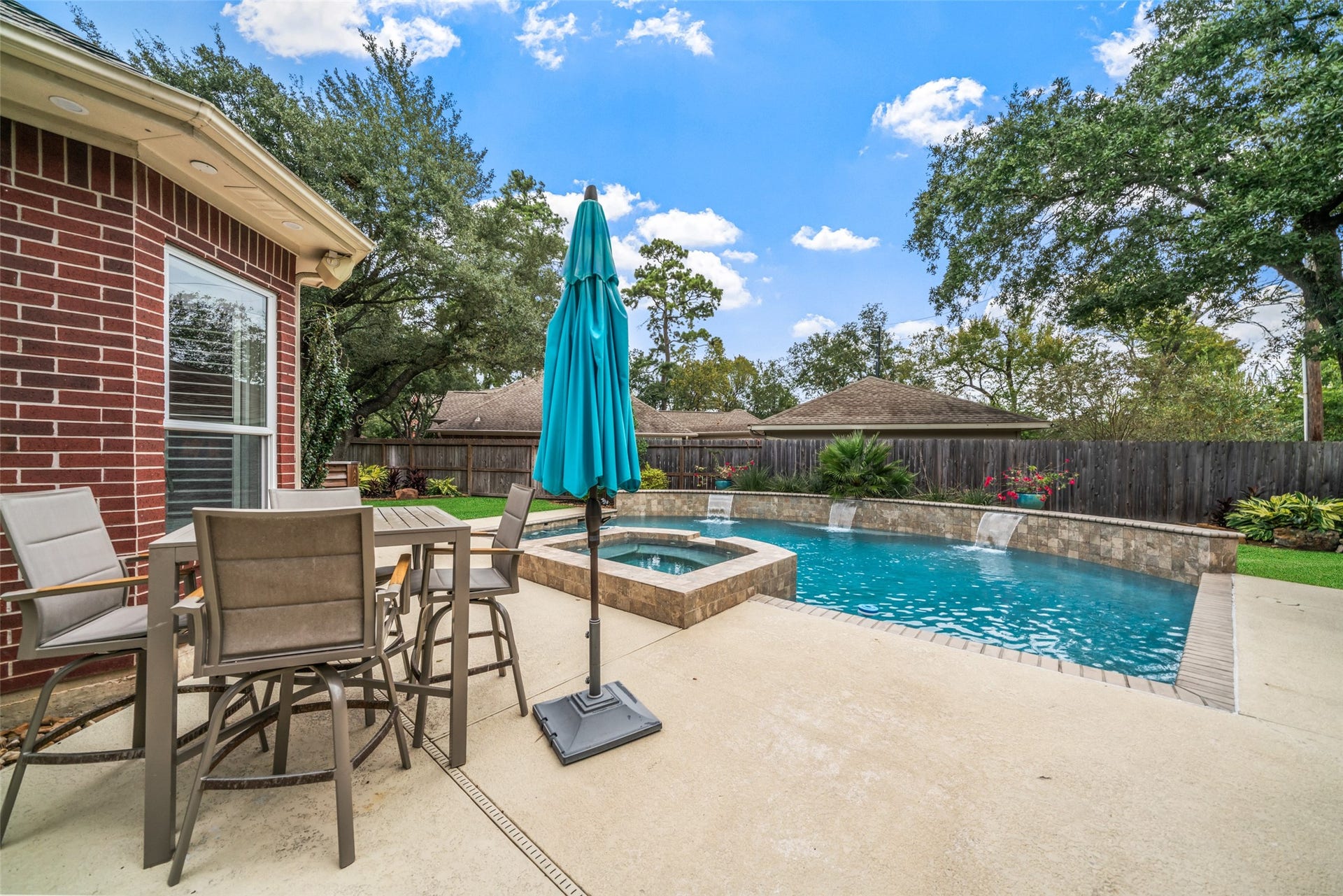 3507 Aspen Glen Lane, Spring, TX 77388 The tan table and chairs are also included with the home. Relaxing poolside opportunities await.