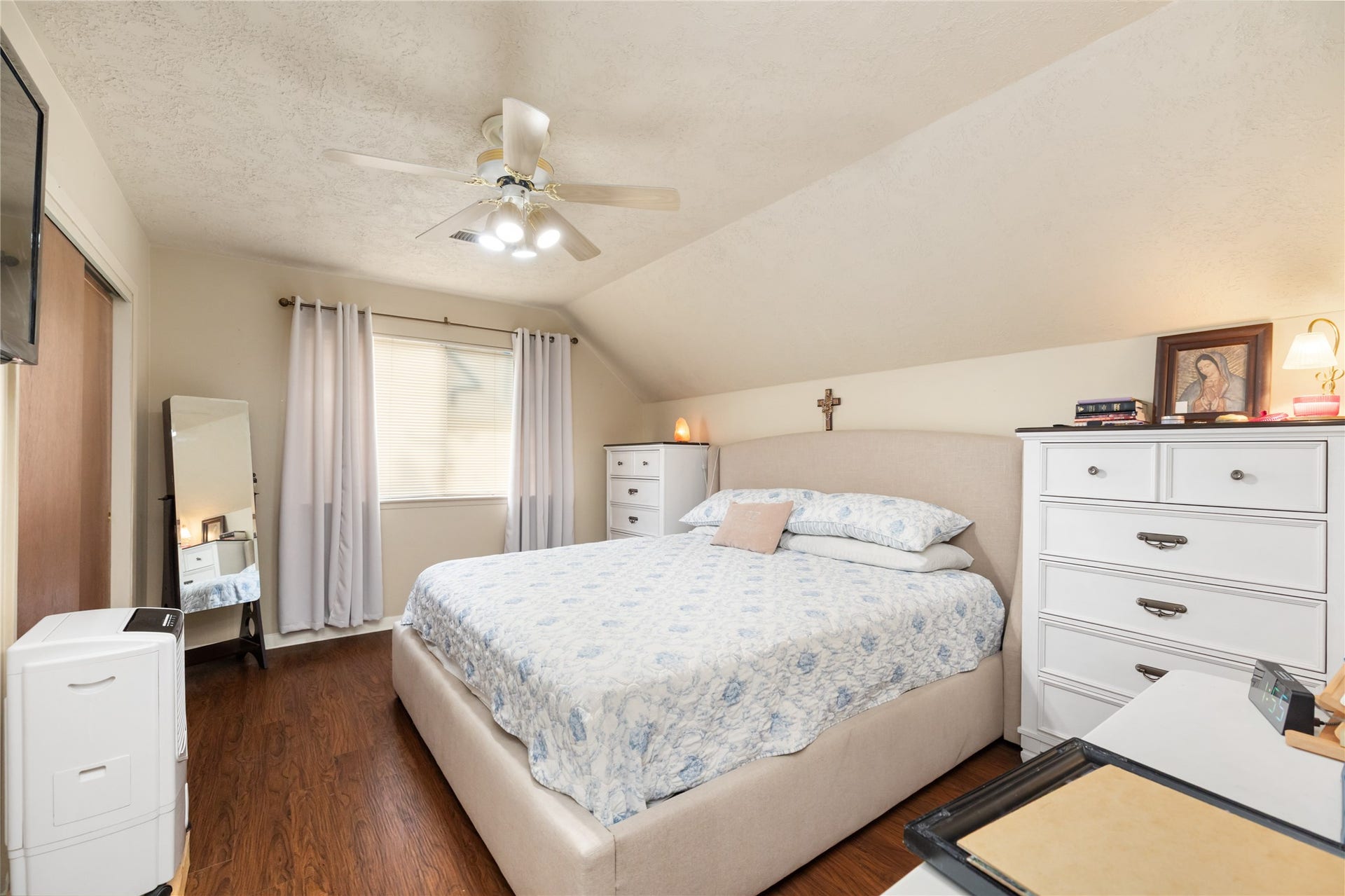 2603 Grape Lane, Pasadena, TX 77502 The large primary bedroom is located upstairs and comes with faux wood plank flooring.