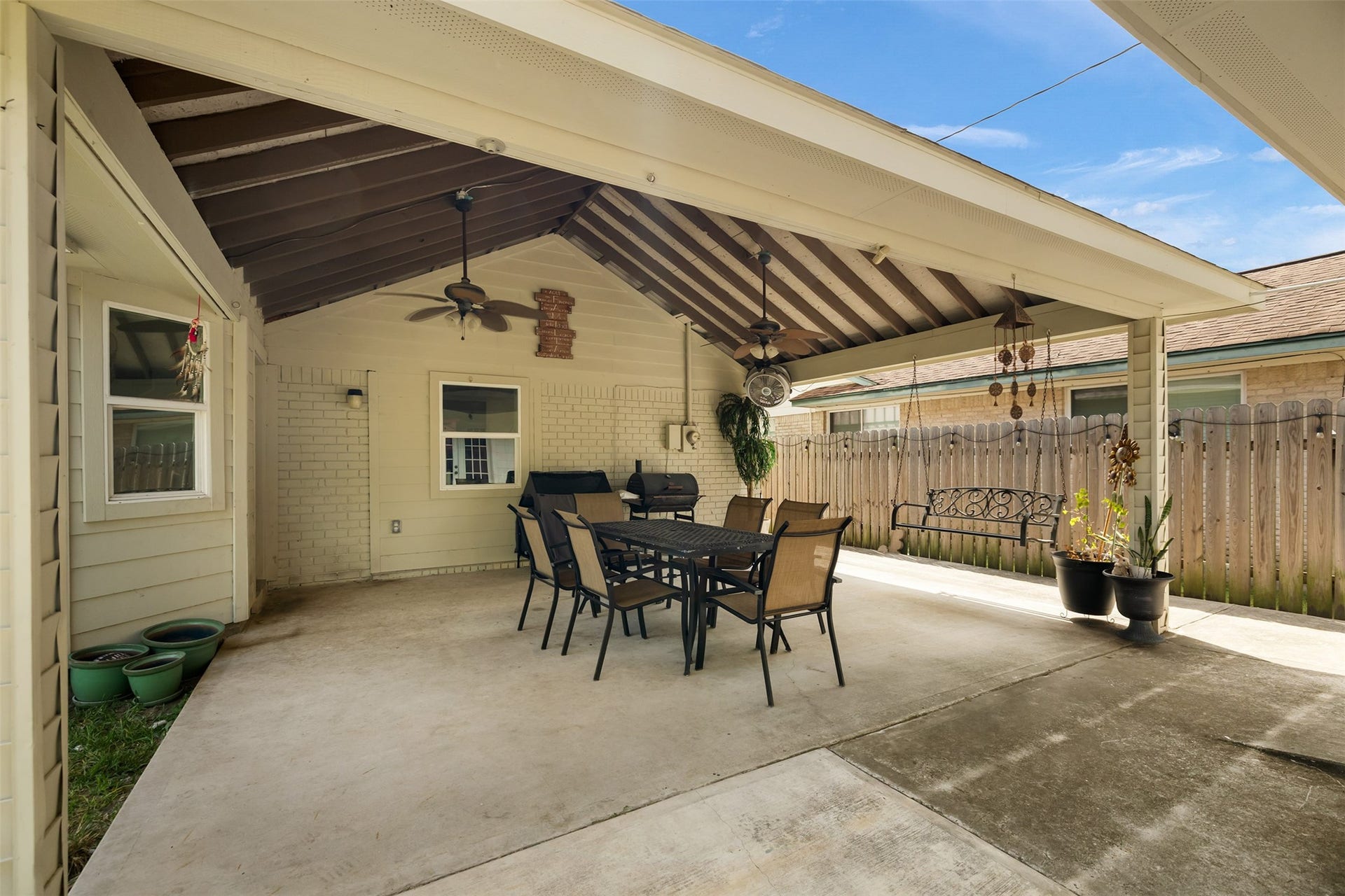 2603 Grape Lane, Pasadena, TX 77502 Large covered back patio with a high-pitched gable roof.