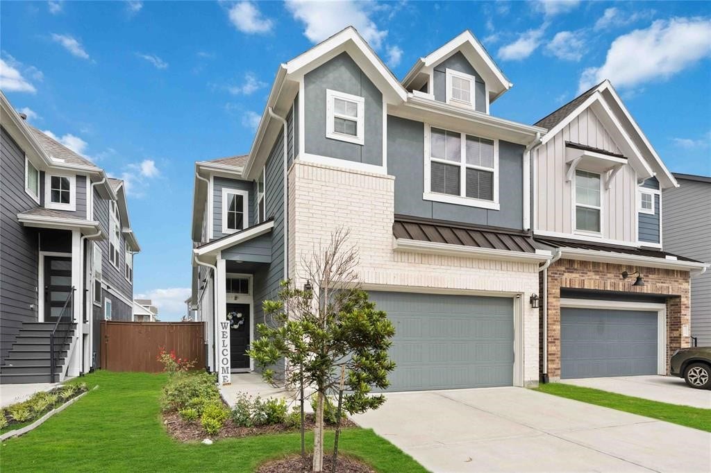 Virtually Staged - This modern two-story home features a stylish exterior with a mix of brick and siding, a spacious double garage, and a welcoming front entrance. The well-maintained lawn and landscaping add to its curb appeal.