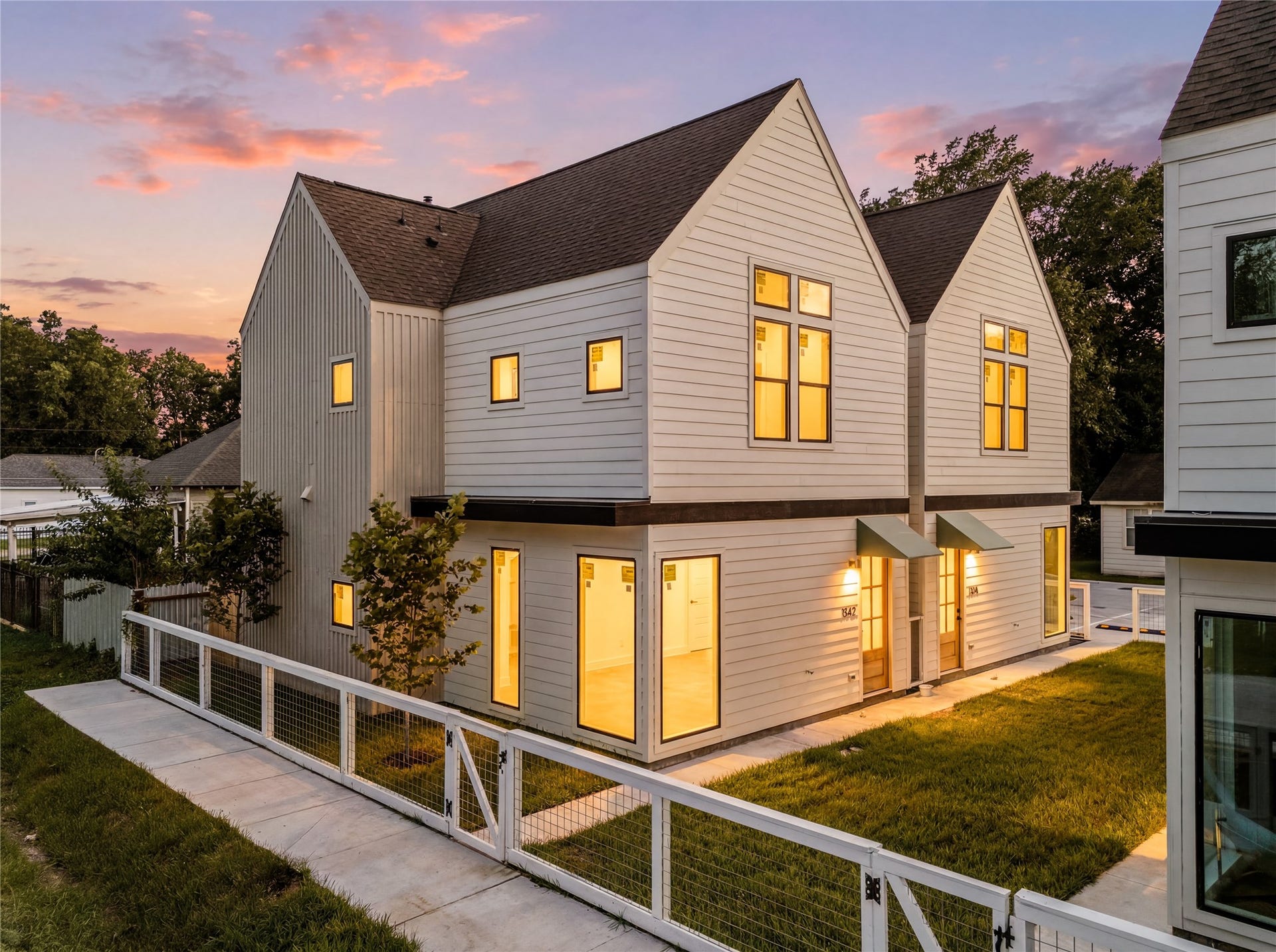 7444 Tremper Street, Houston, TX 77020 Contemporary dual-gable design with designated pedestrian paths.