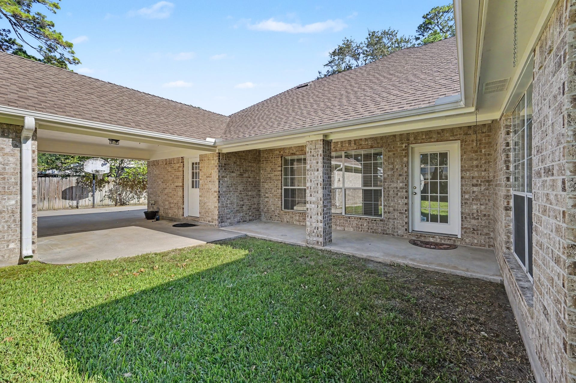 419 Dover Lane, Spring, TX 77373 Another view of the spacious covered patio, perfect for outdoor relaxation, with easy access to the backyard from the living room.