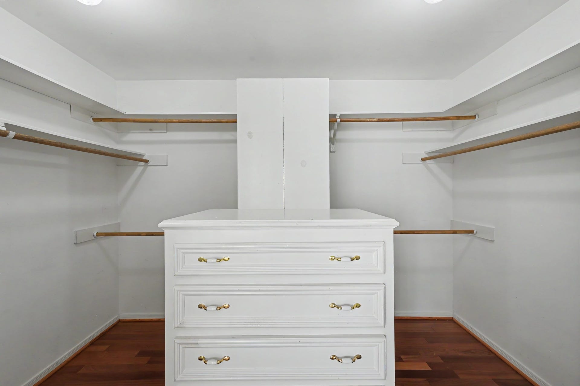 419 Dover Lane, Spring, TX 77373 Spacious primary walk-in closet featuring ample hanging space and a central storage island for all your belongings.