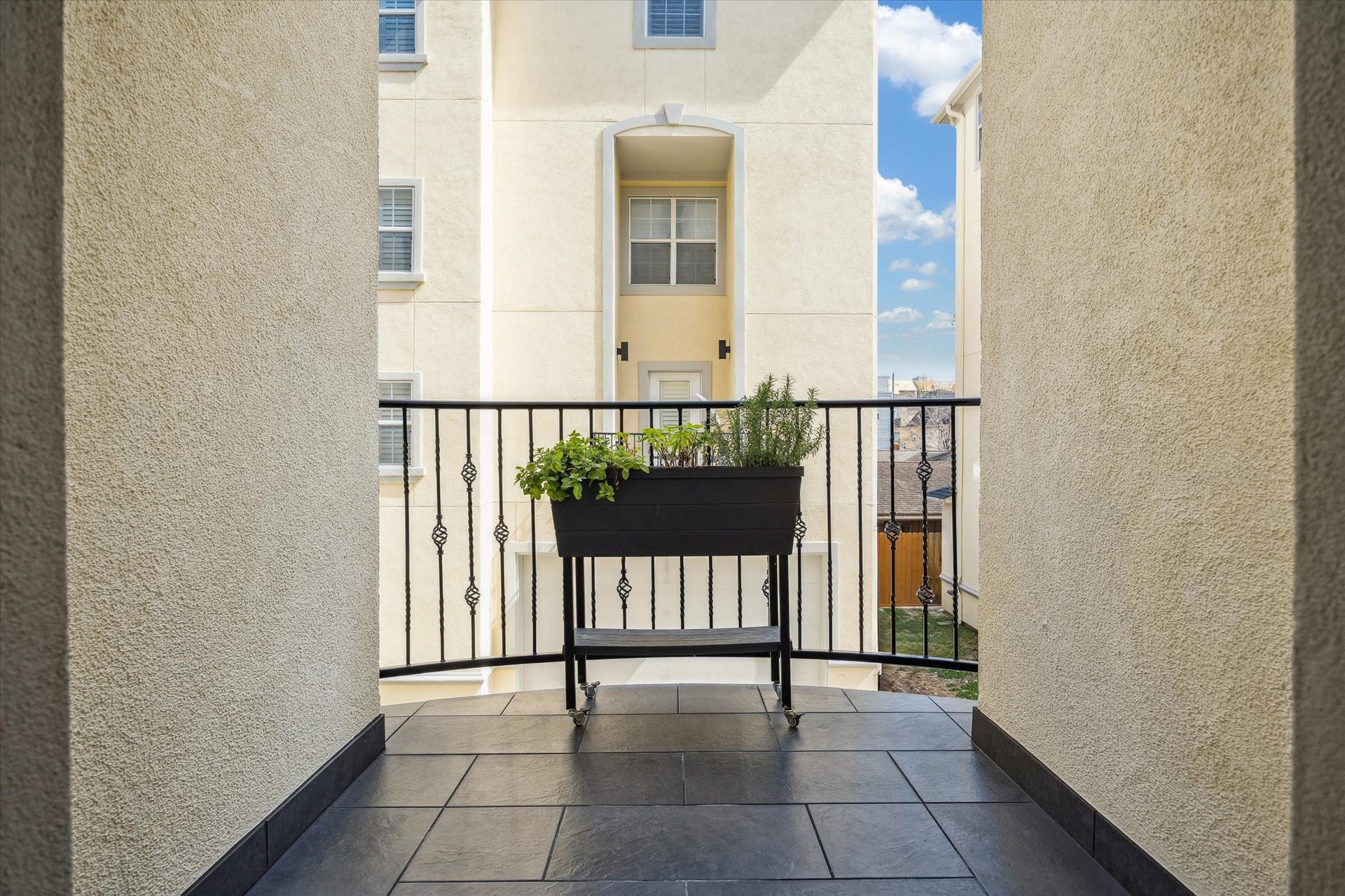 5717 Val Verde Street, #C, Houston, TX 77057 The kitchen-adjacent balcony is a functional stylish space, think a bistro set to enjoy your morning hot drink, a planter with your favorite herbs....