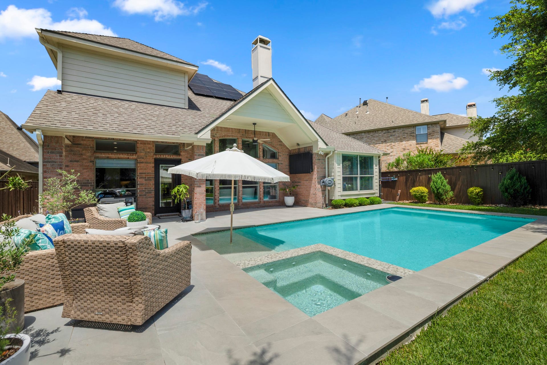 26 Winhall Place, The Woodlands, TX 77354 From morning coffee on the patio to an afternoon dip in the pool, this backyard makes staying home feel like a getaway.