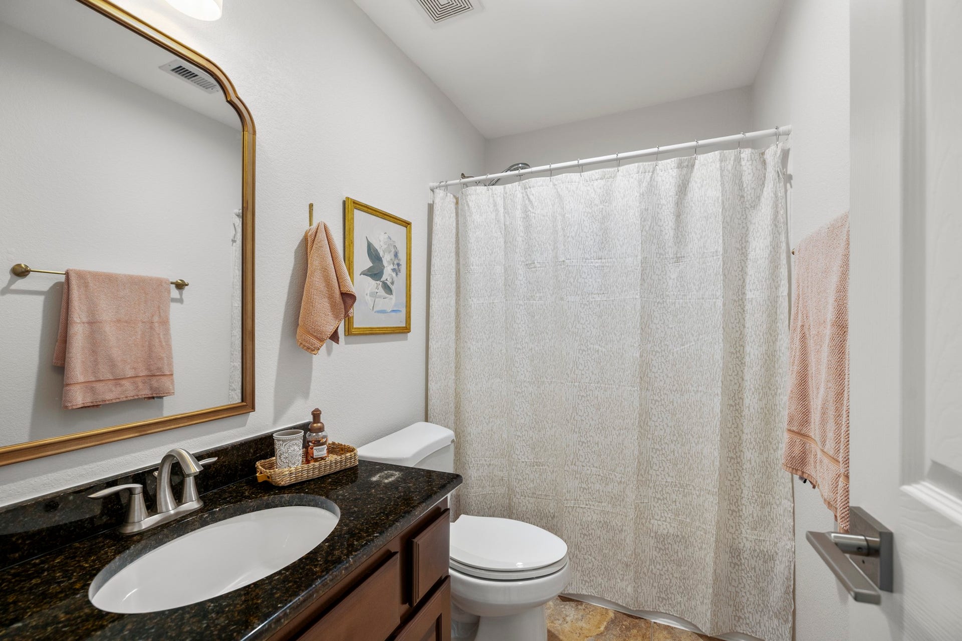 26 Winhall Place, The Woodlands, TX 77354 A full upstairs bath with a tub-shower combination makes busy mornings and bedtime routines a little easier.