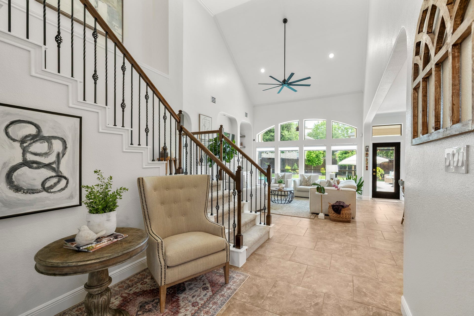 26 Winhall Place, The Woodlands, TX 77354 From the moment you walk through the door, natural light, high ceilings, and an open view into the home create a warm welcome.