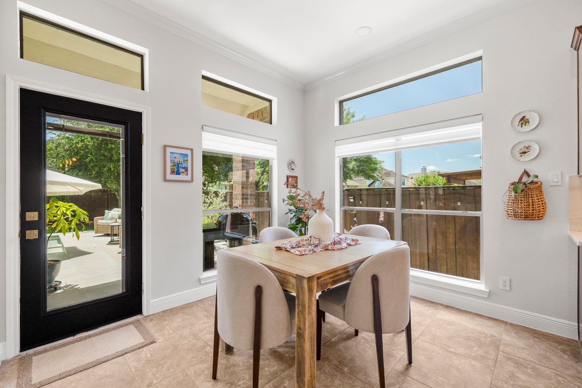 26 Winhall Place, The Woodlands, TX 77354 Start the morning here with coffee and breakfast, surrounded by natural light and peaceful views of the backyard.