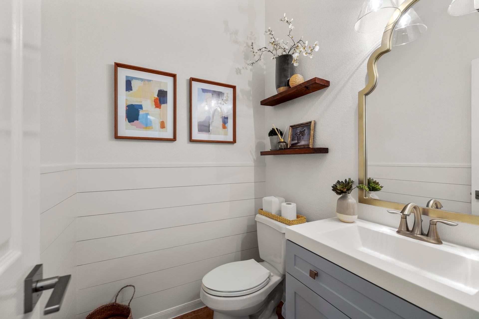 26 Winhall Place, The Woodlands, TX 77354 Even the powder bath has personality, with custom shiplap and thoughtful updates that make this small space stand out.