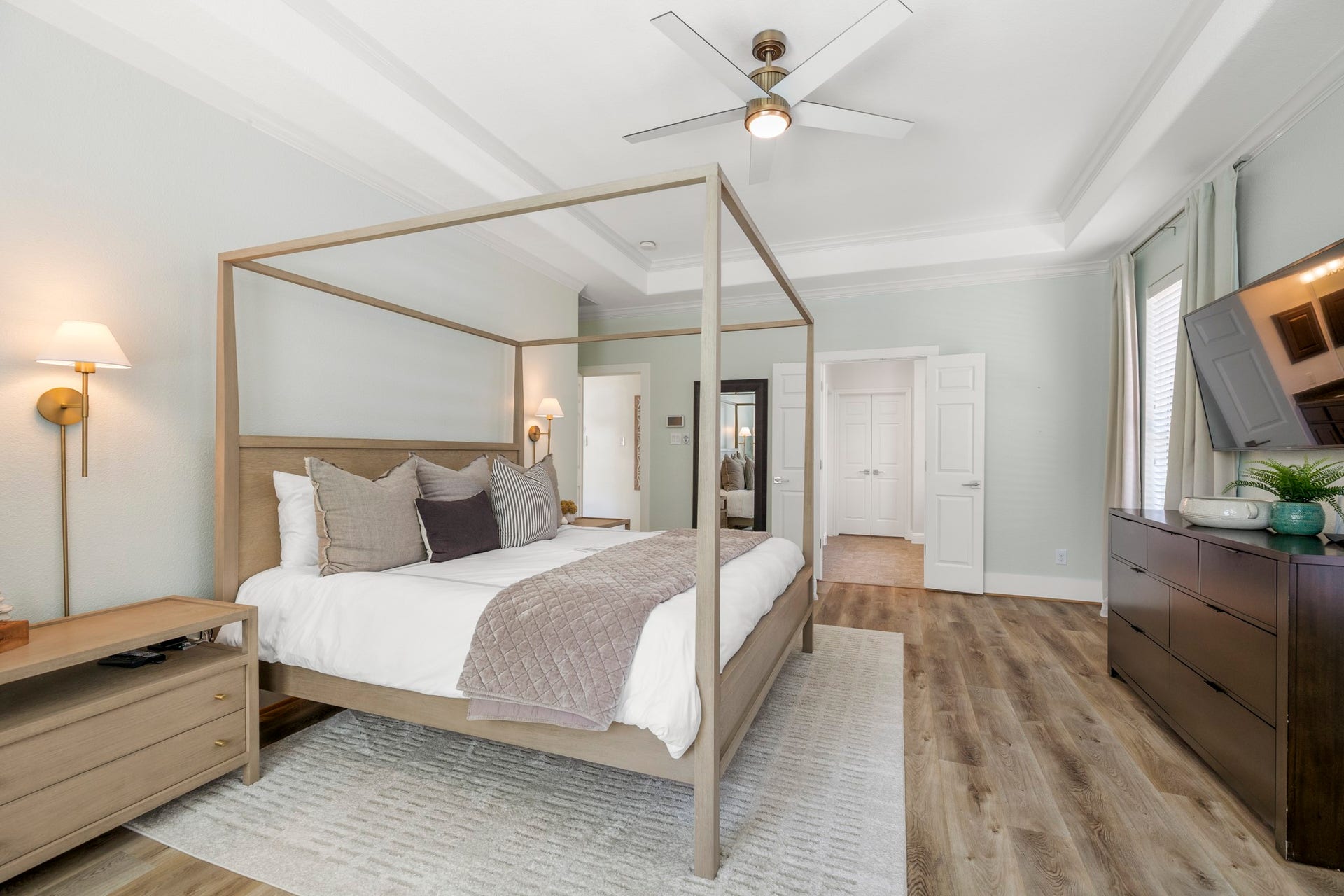 26 Winhall Place, The Woodlands, TX 77354 Tray ceilings, crown molding, and abundant natural light add an elevated feel to your private retreat.