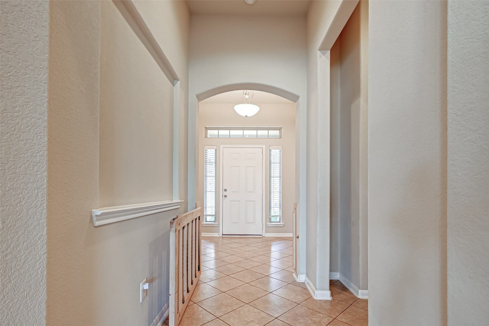 402 Conchola Lane, Richmond, TX 77469 Arched openings and high ceilings help elevate the space.