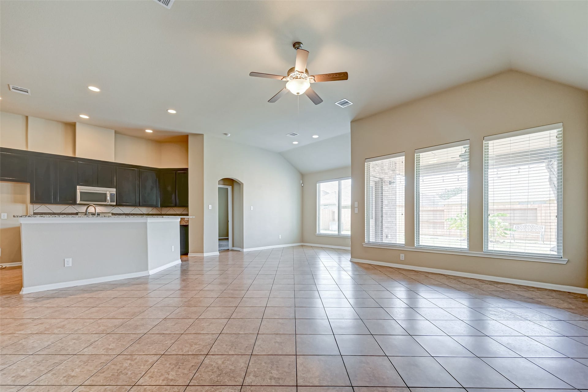 402 Conchola Lane, Richmond, TX 77469 View of the living space with the kitchen on the left.