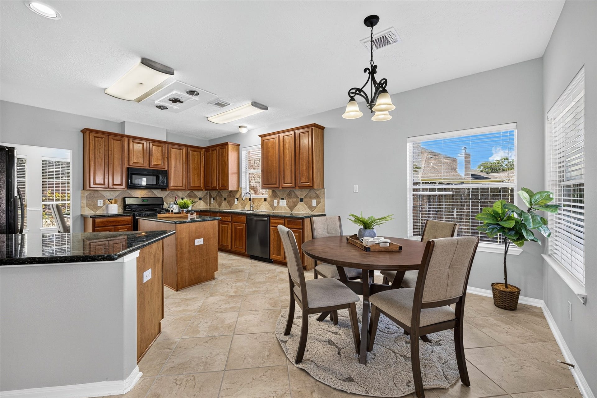 30 Palm Villas Drive, Manvel, TX 77578 Expansive windows fill the space with warm sunshine, making it the perfect spot to savor your daily coffee and start every morning on a cheerful note.