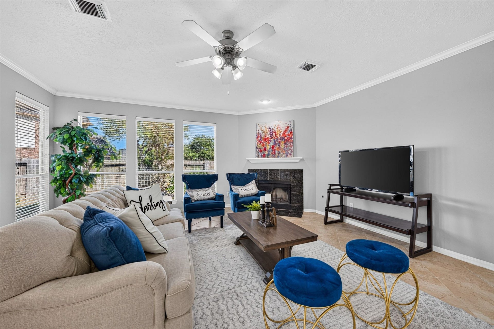 30 Palm Villas Drive, Manvel, TX 77578 Warm up on cool evenings around the cozy fireplace, creating an inviting focal point for family movie nights or quiet relaxation.