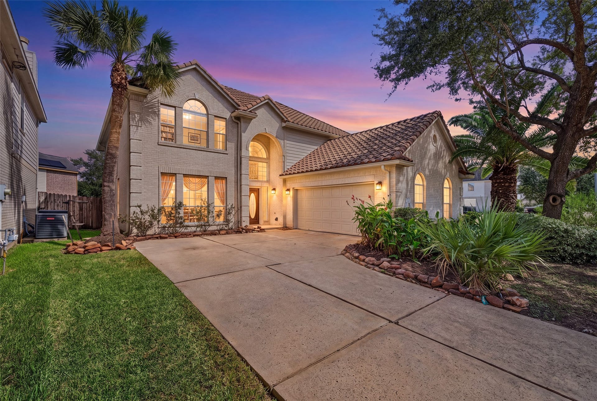 30 Palm Villas Drive, Manvel, TX 77578 Welcome home to this stunning corner lot framed by lush, manicured landscaping.