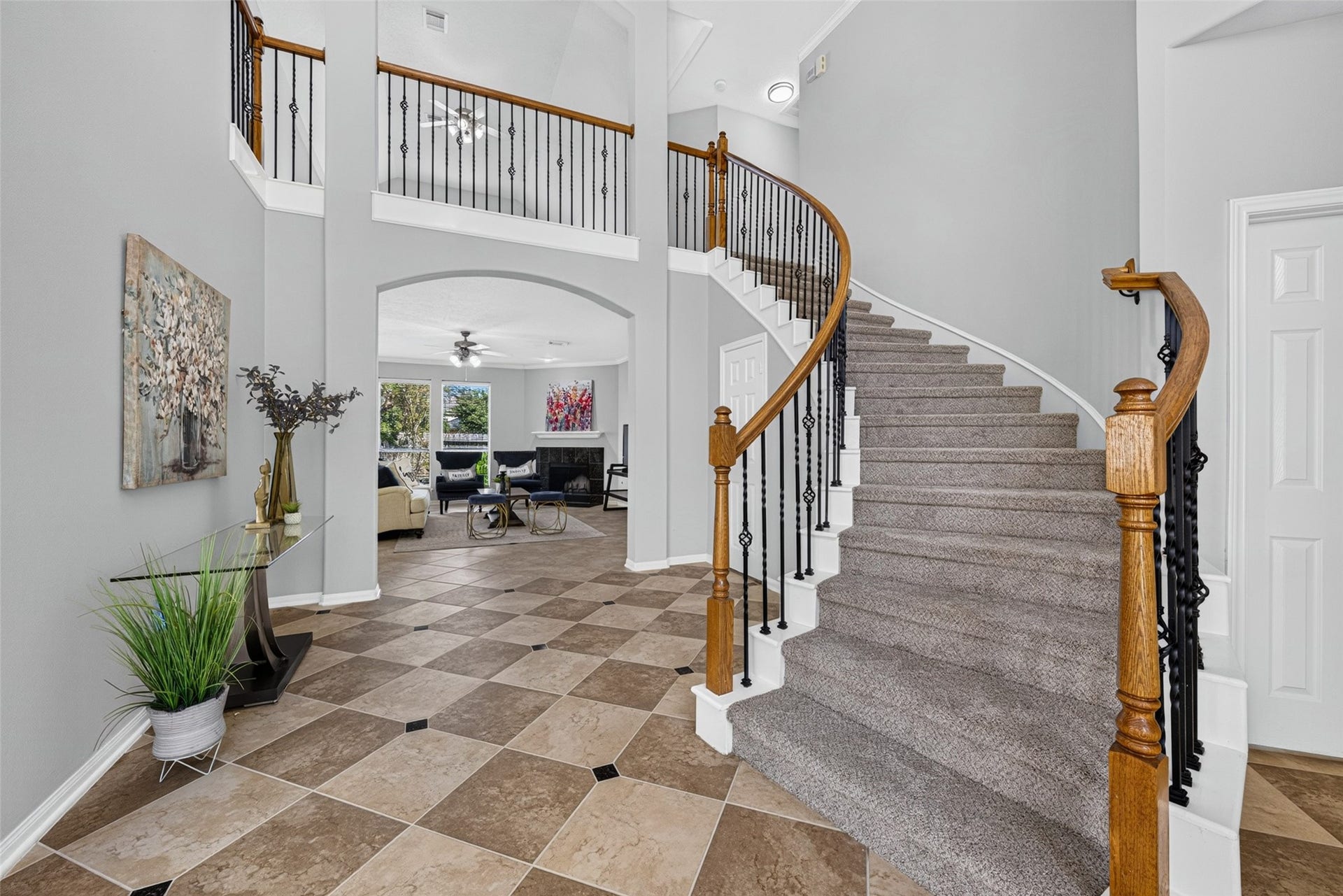 30 Palm Villas Drive, Manvel, TX 77578 Step inside to a delightful entryway that immediately feels like home, highlighted by classic checkered tile flooring that adds a touch of timeless sophistication.