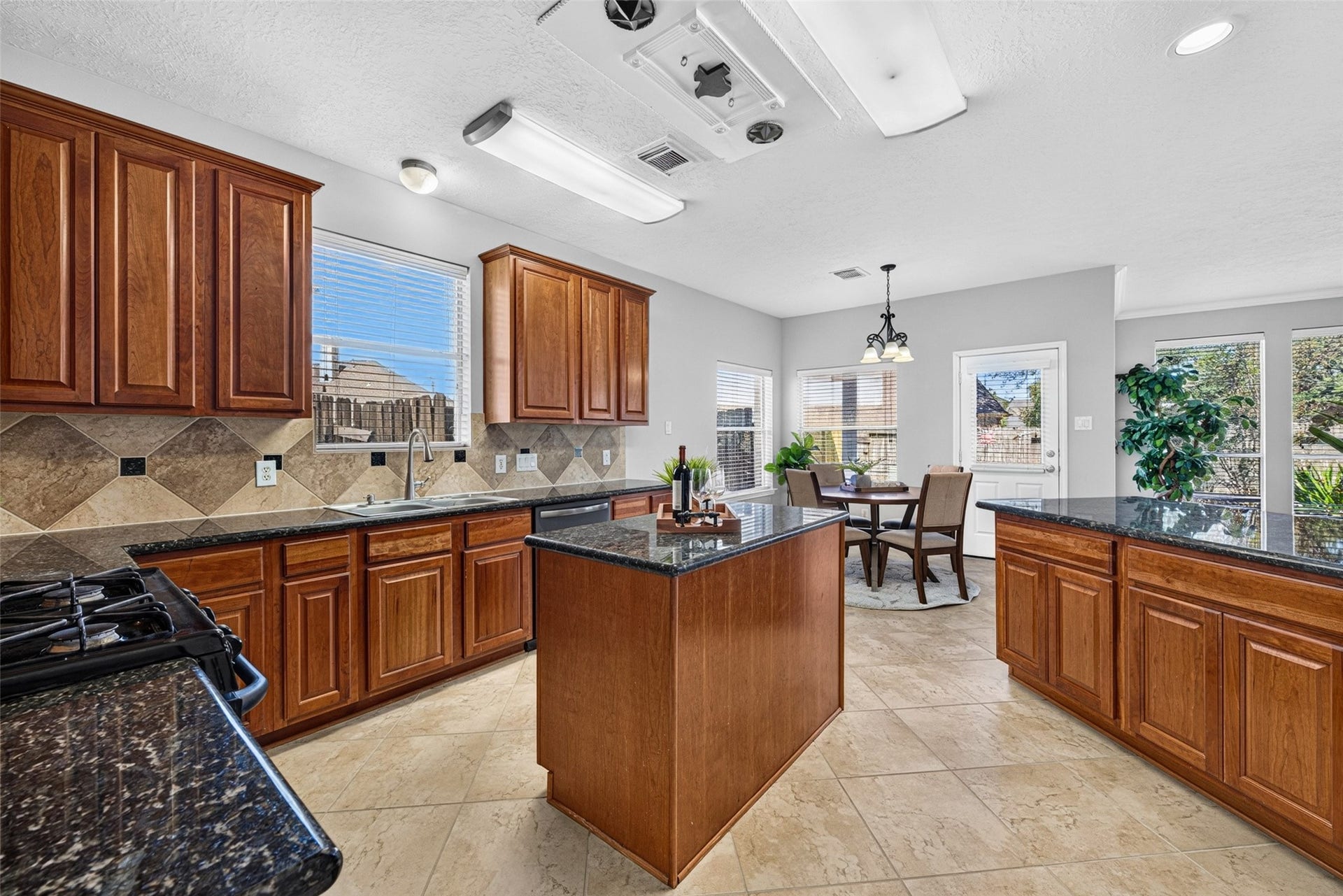 30 Palm Villas Drive, Manvel, TX 77578 Crafted with love, the heart of this kitchen showcases custom-built wood cabinetry that provides both beauty and endless storage for family recipes.
