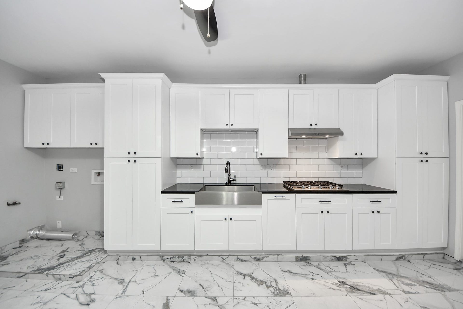 A standout feature you do not see every day  this upgraded garage combines function and flexibility with cabinetry, a sink, and a cooktop.