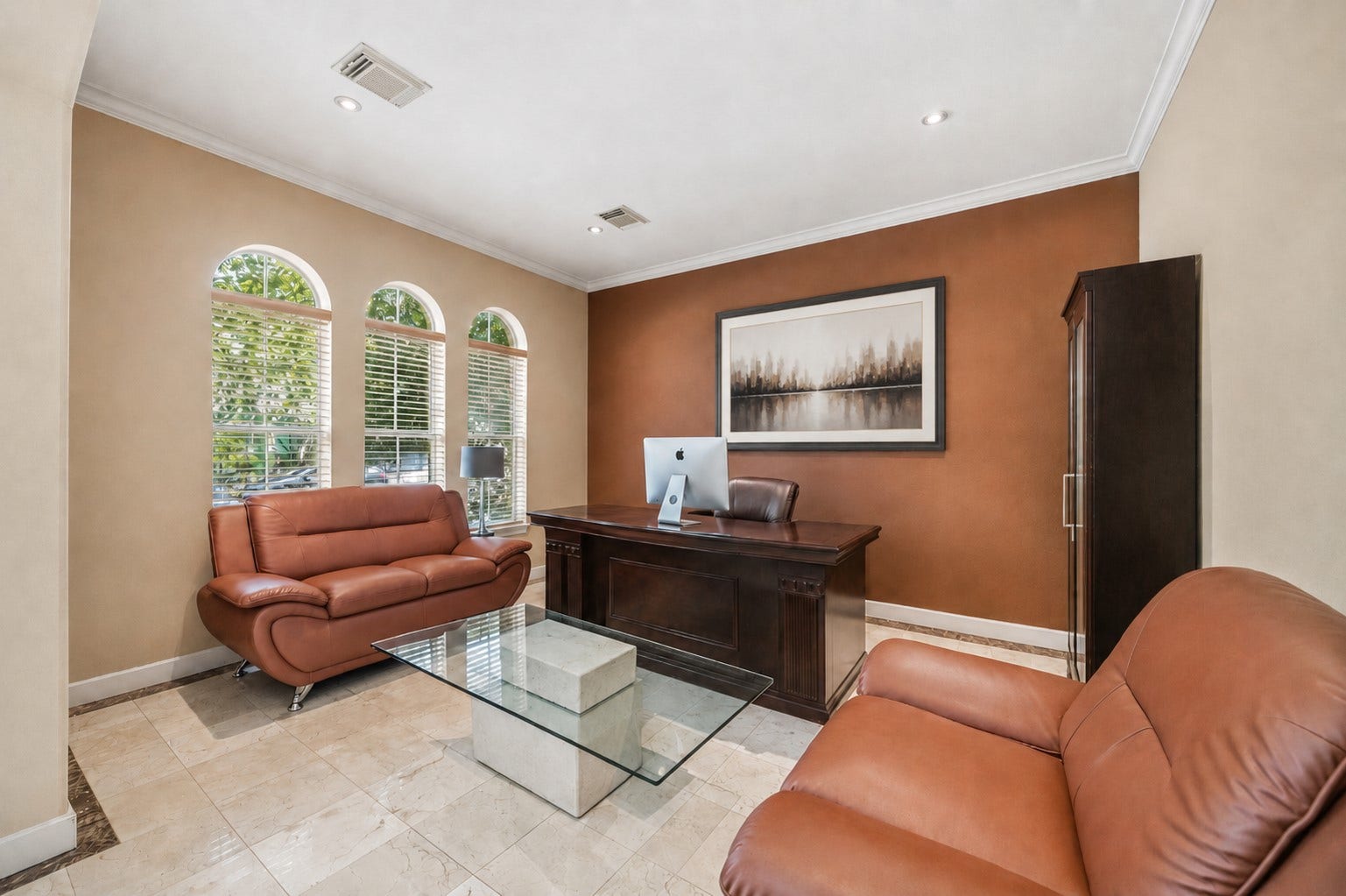 7610 Guinevere Drive, Sugar Land, TX 77479 This versatile home office features three elegant arched front windows with built-in blinds, track lighting, and pristine tile floors.