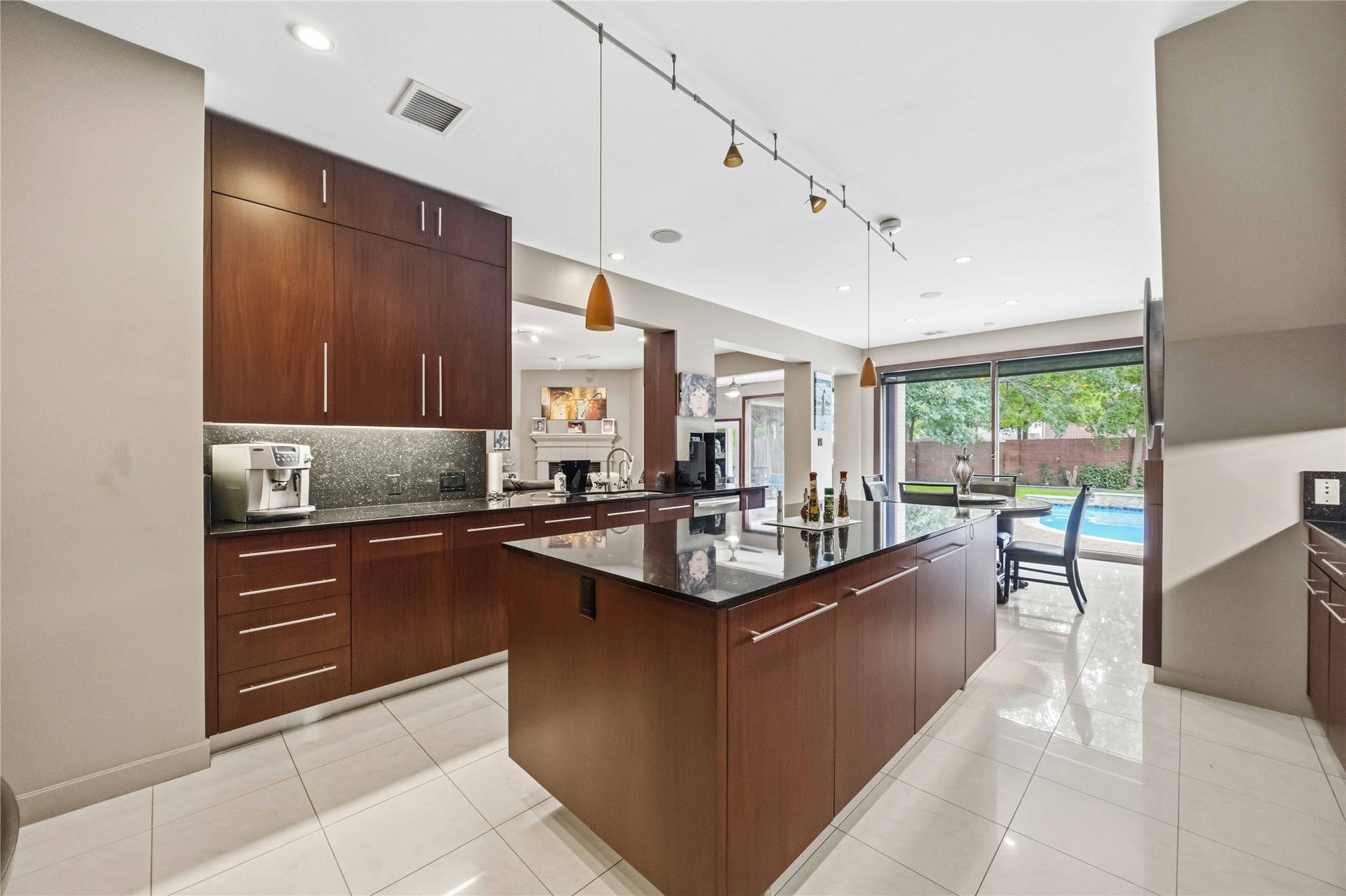 7610 Guinevere Drive, Sugar Land, TX 77479 The open kitchen layout flows naturally into a bright breakfast alcove bounded by large rear-facing windows.
