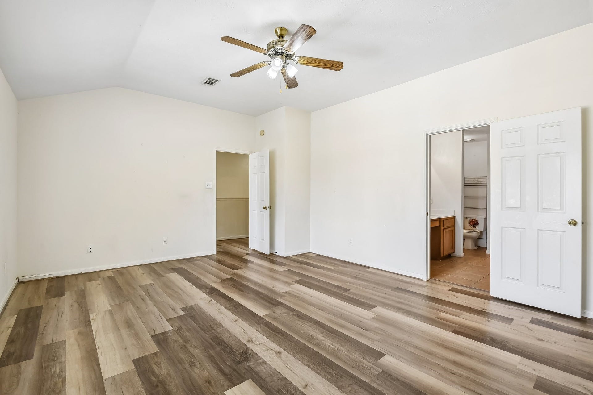 12006 Thornburg Lane, Houston, TX 77067 Primary bedroom has walk in closet and en suite bath.