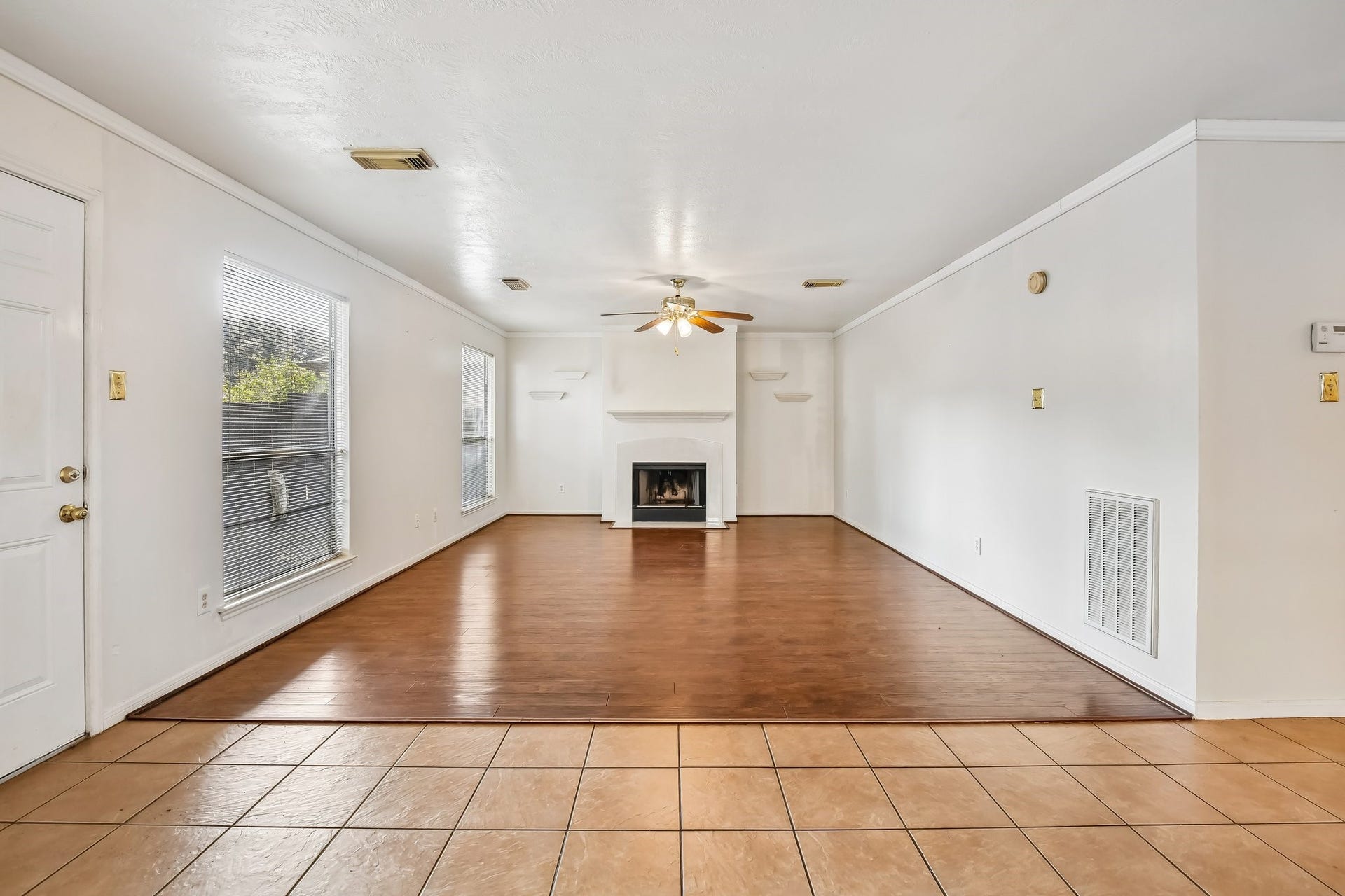 12006 Thornburg Lane, Houston, TX 77067 Large family room with cozy fireplace.