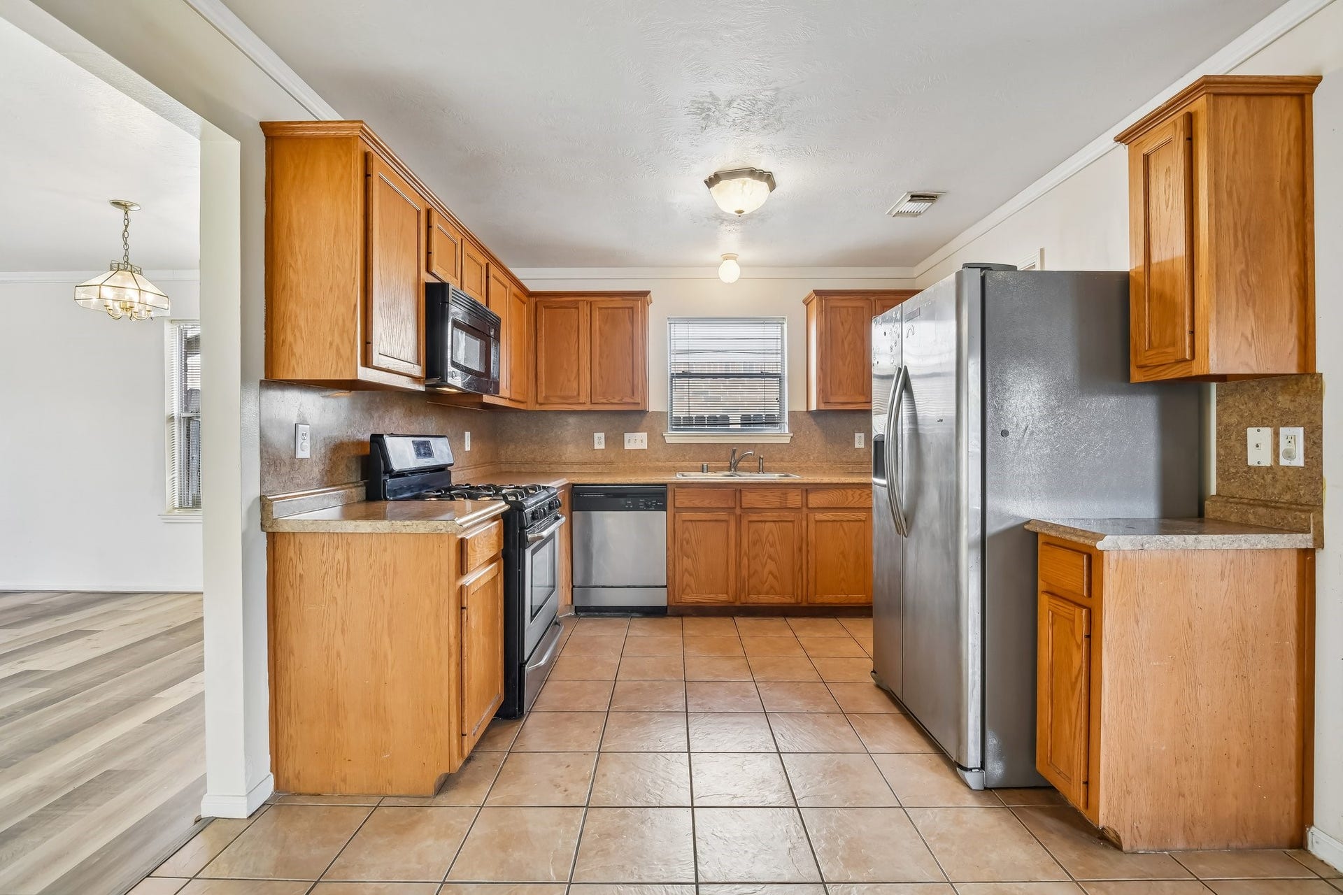 12006 Thornburg Lane, Houston, TX 77067 Kitchen with dining room to the left.