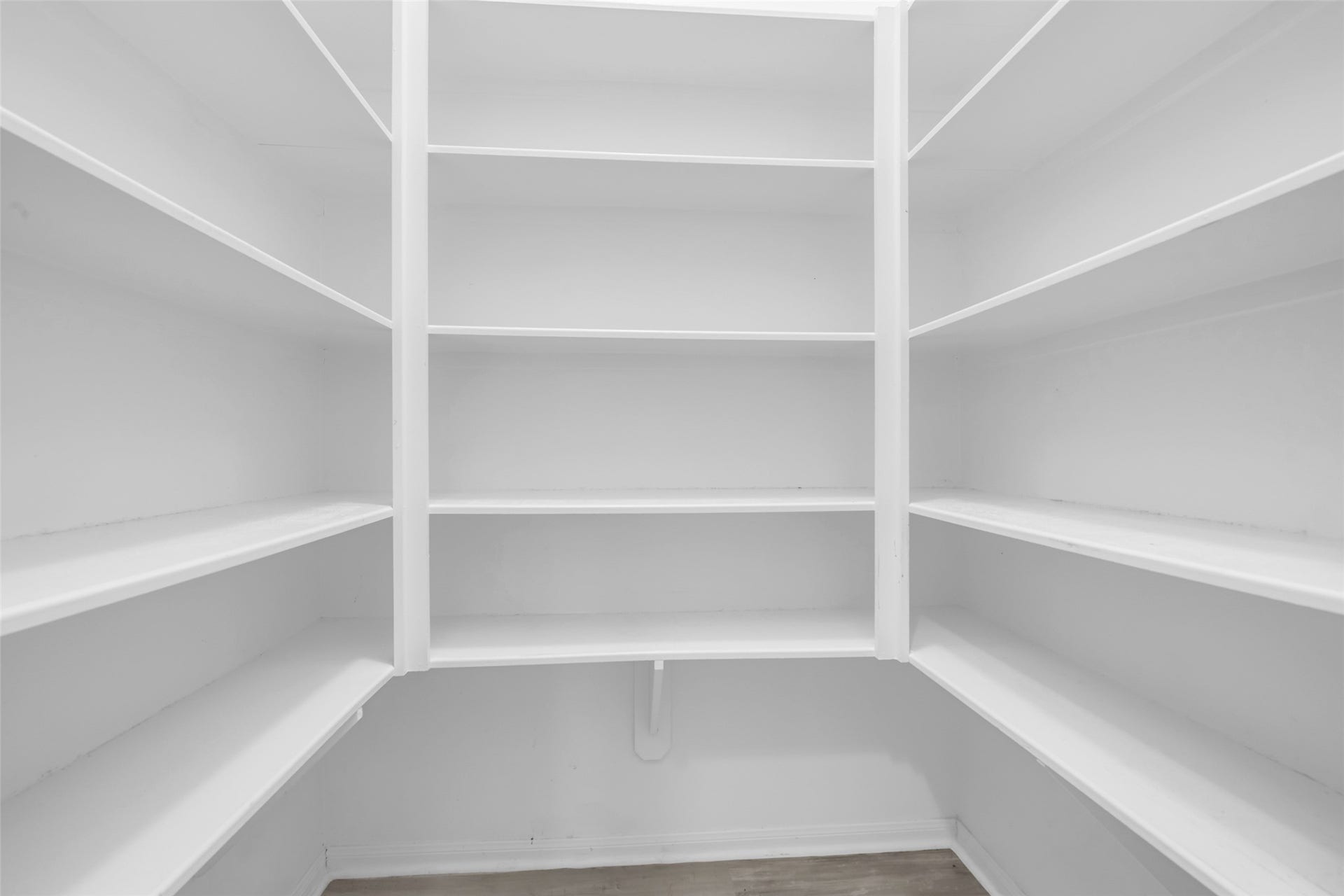 8121 Tranquil Lake Way, Conroe, TX 77385 Spacious walk-in pantry with ample shelving for organized storage.