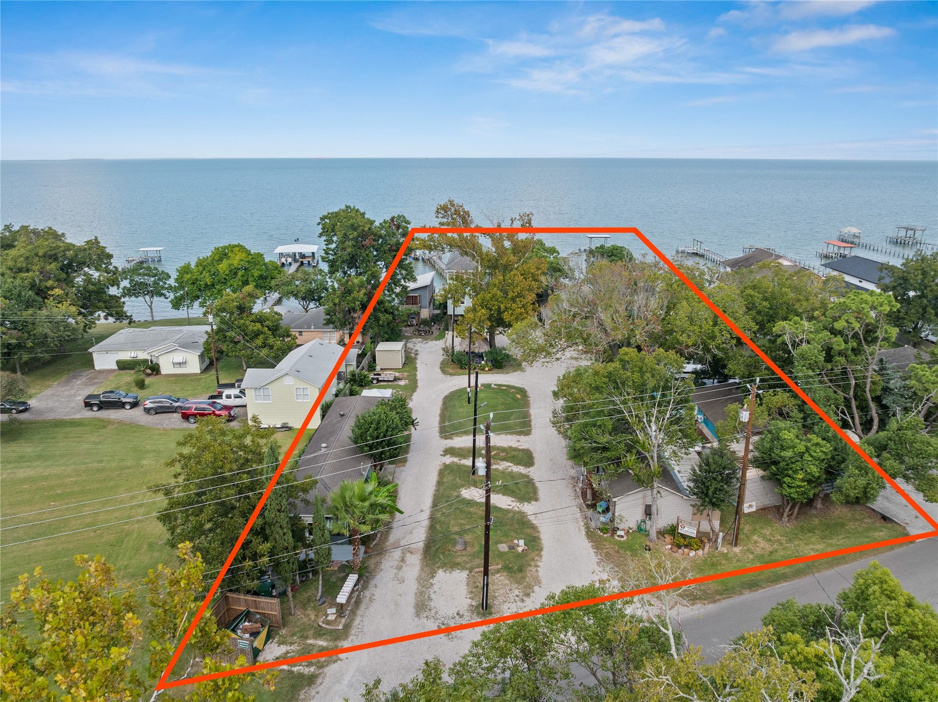 3709 Bayshore Drive, #1-12, Bacliff, TX 77518 This photo from Bayshore shows the spacious, tree-lined property outlined in red, positioned near the waterfront.