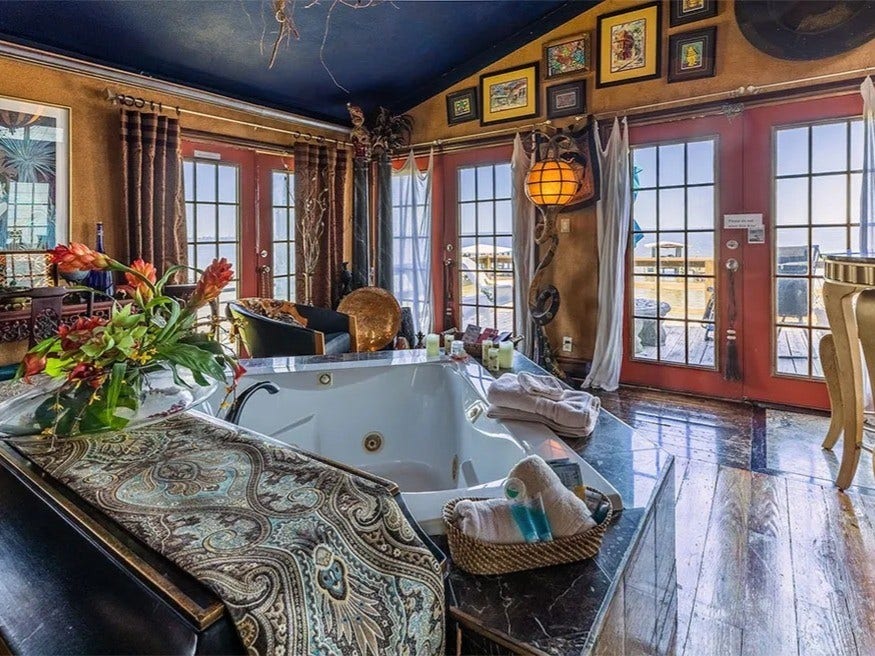 3709 Bayshore Drive, #1-12, Bacliff, TX 77518 Luxurious La View retreat with stunning views. This space features elegant decor, a relaxing jacuzzi, and abundant natural light through large windows and French doors. Perfect for unwinding in style.