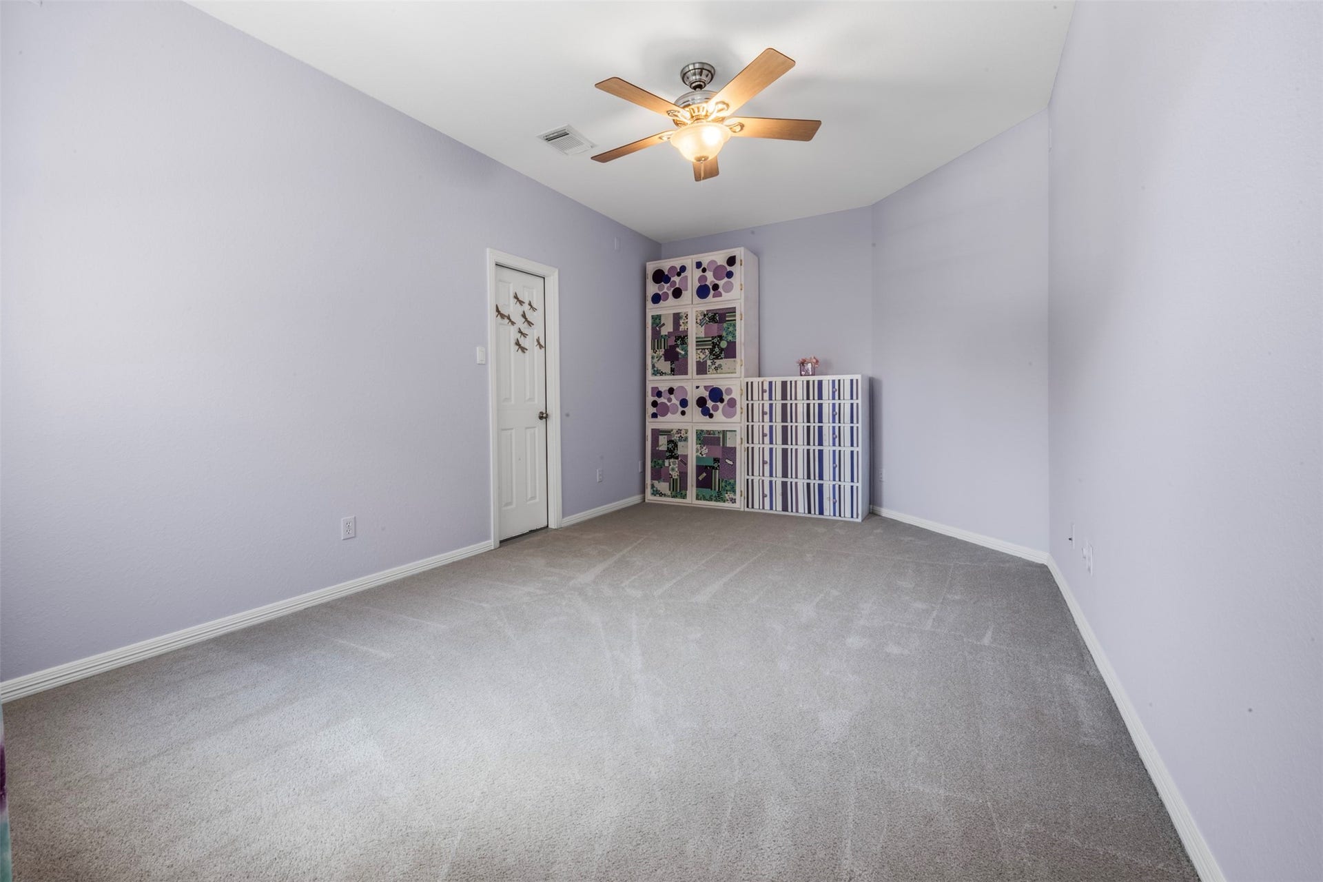 26418 Cottage Cypress Lane, Cypress, TX 77433 This spacious flex room offers endless possibilitiesperfect for a craft room, art studio, playroom, or home office. Filled with natural light and featuring a neutral palette, the space provides a comfortable and inspiring environment for creativity or productivity. A standout feature is the direct access to a large walk-in attic, offering exceptional storage space for holiday dcor and seasonal items, keeping everything conveniently within reach.